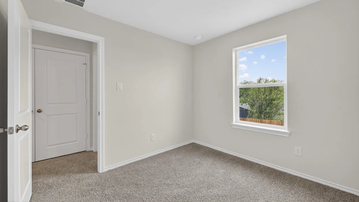 Neutral wall finishes, recessed lighting, and carpeted flooring