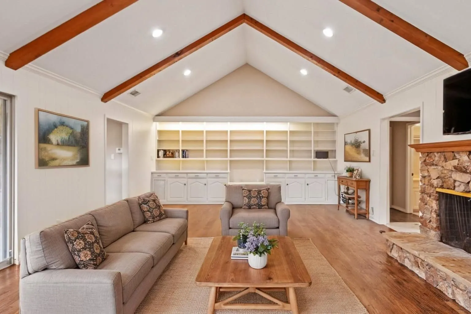 Living Room with fireplace and built in shelving