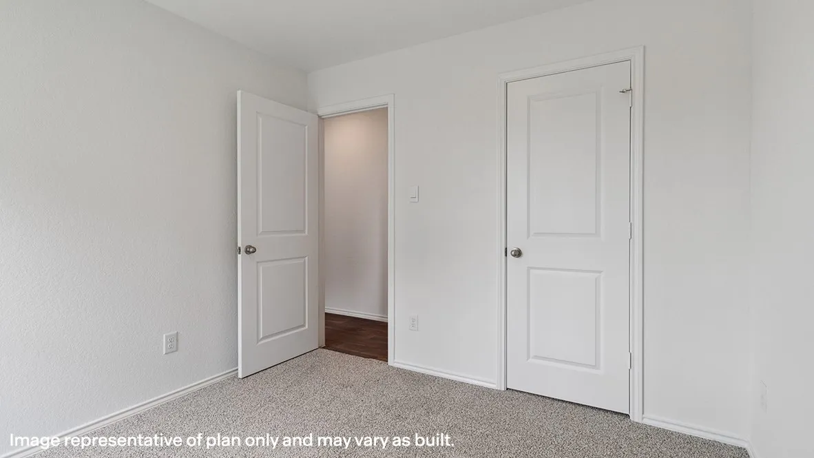 Textured white walls with white trim and grey carpet