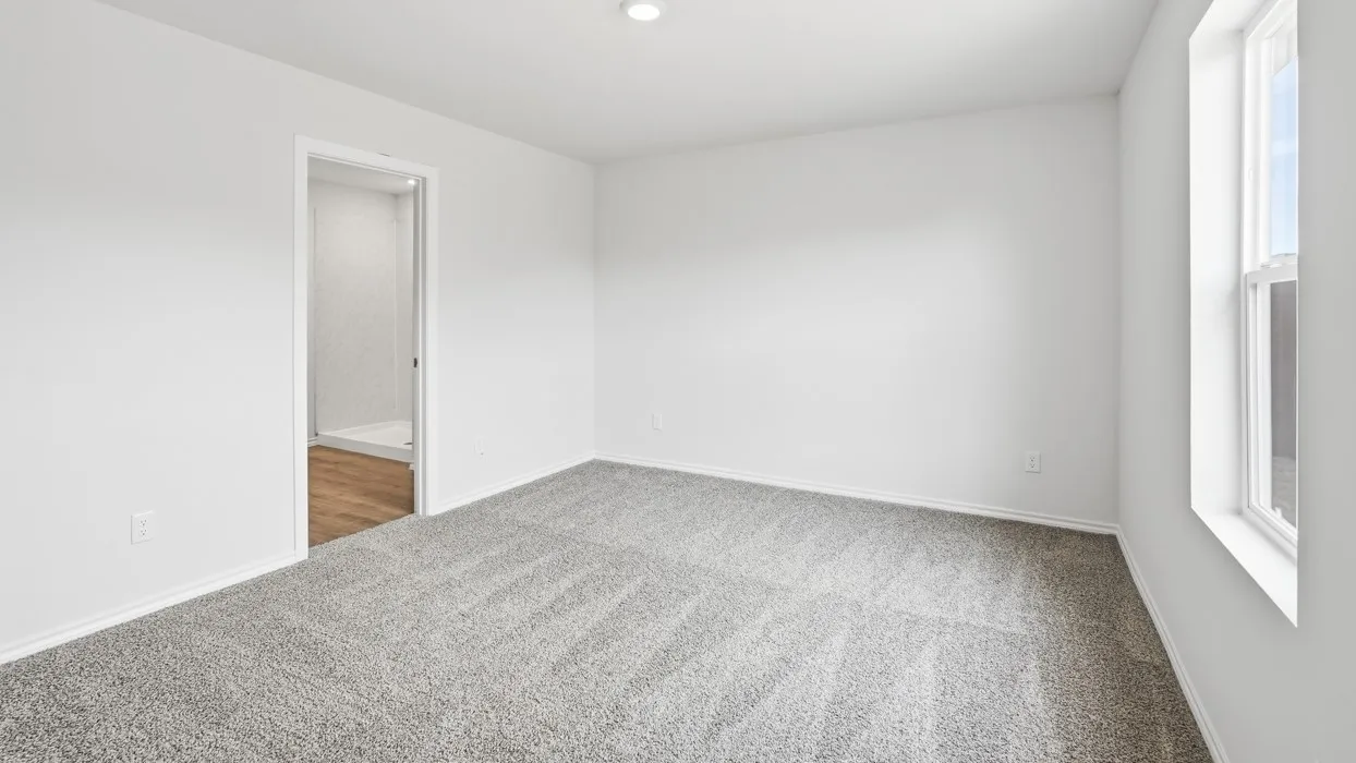Recessed ceiling lighting, light-toned carpeting, white walls, and a single-hung window