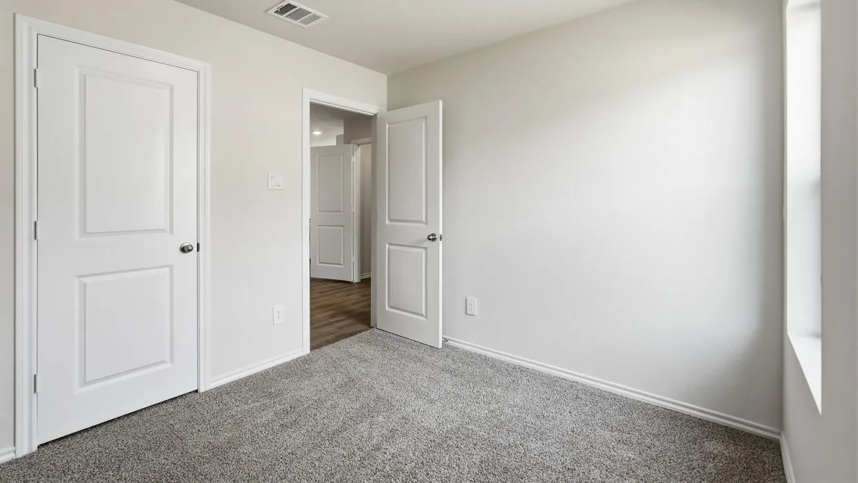 Light grey carpeting with light-colored walls and white trim