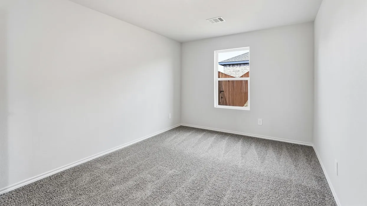 Neutral-toned walls complement the gray carpeted flooring