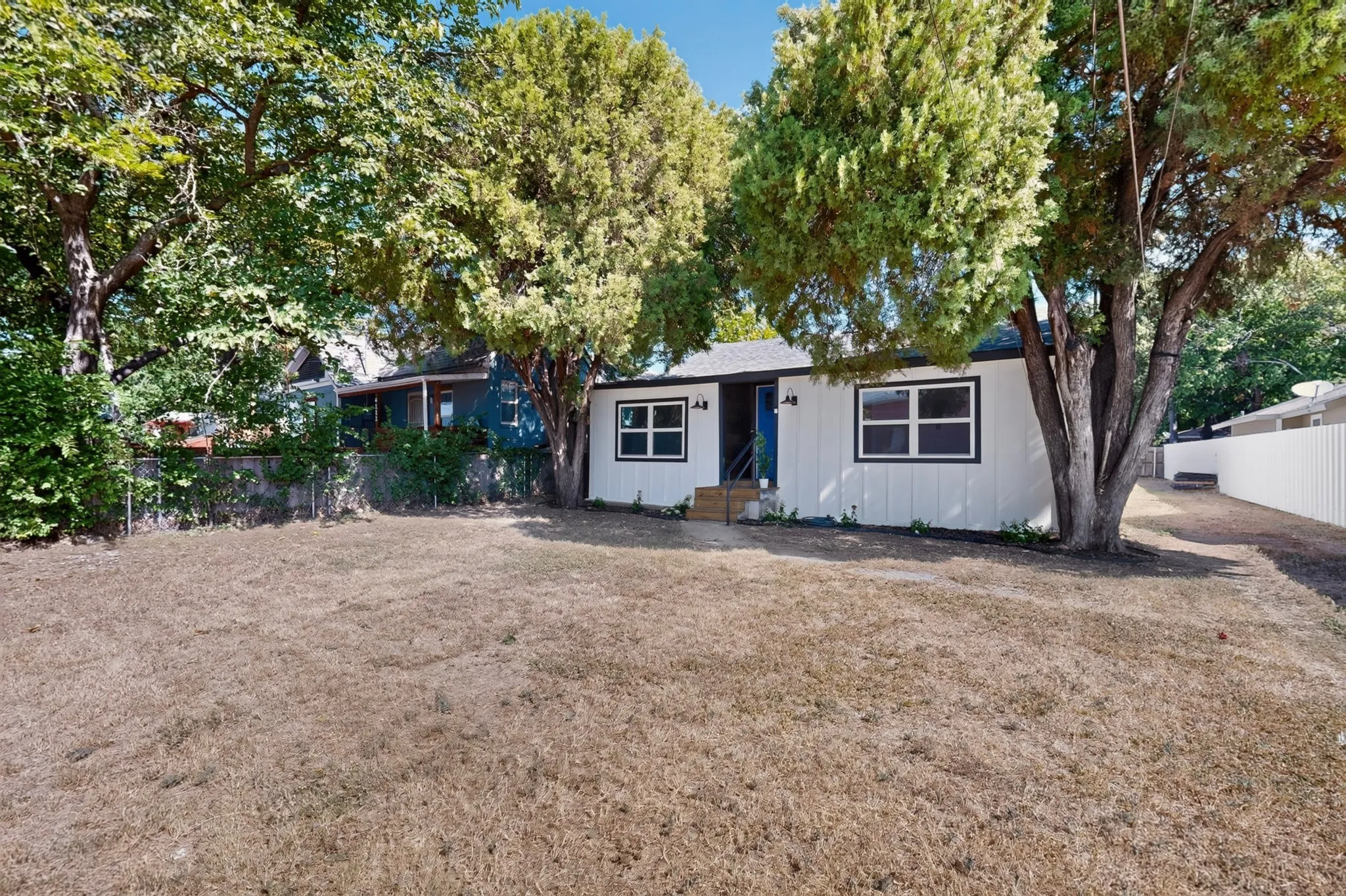 White exterior with dark trim windows