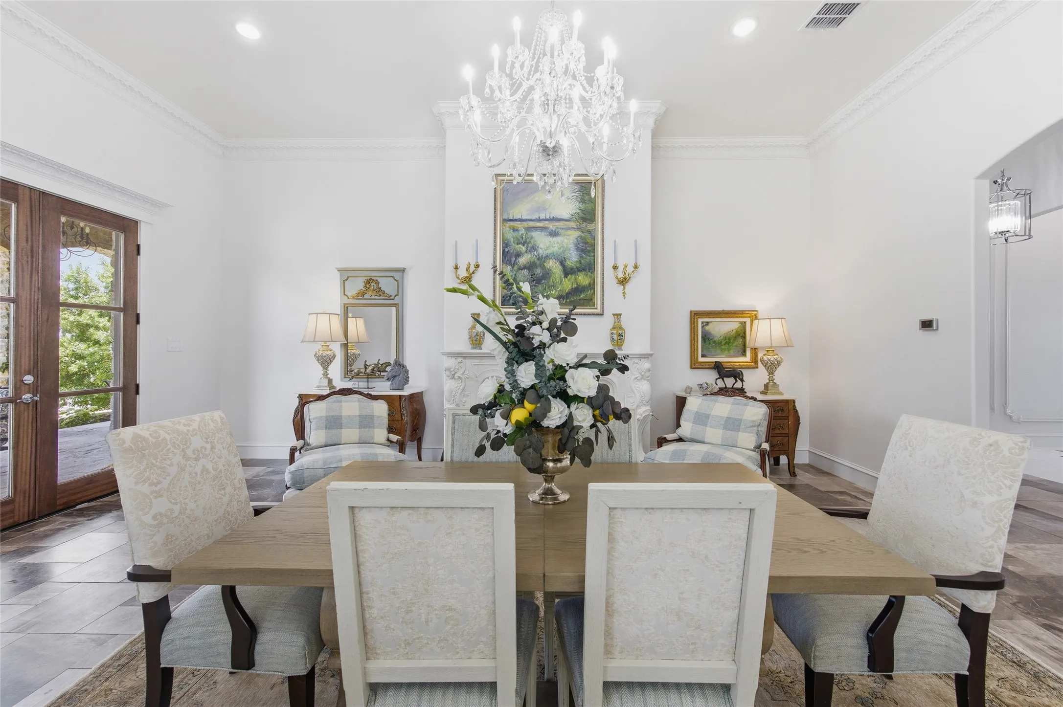 Formal dining room featuring a crystal chandelier, recessed lighting, and crown molding