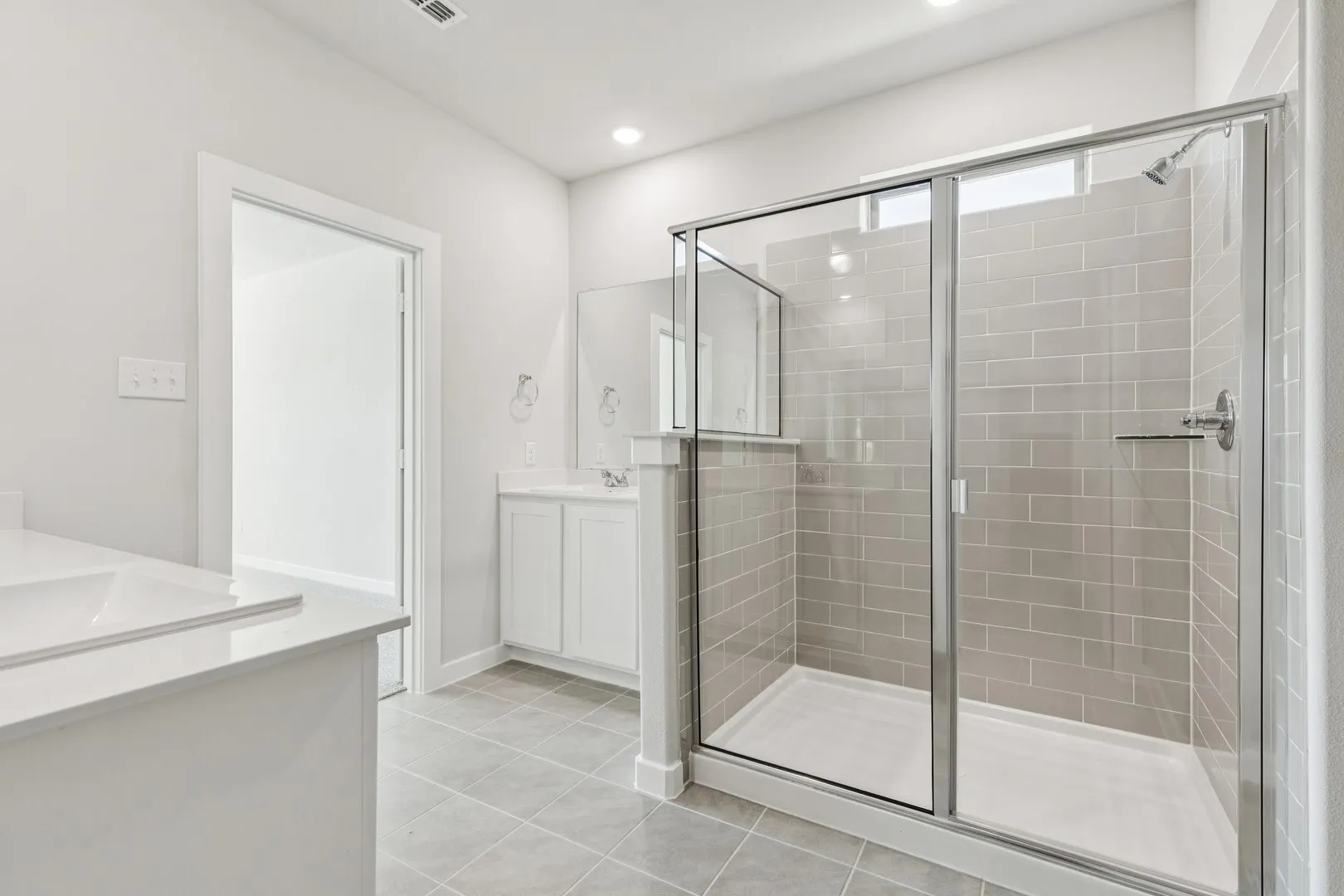 Primary Bathroom in the Winters home plan by Trophy Signature Homes – REPRESENTATIVE PHOTO