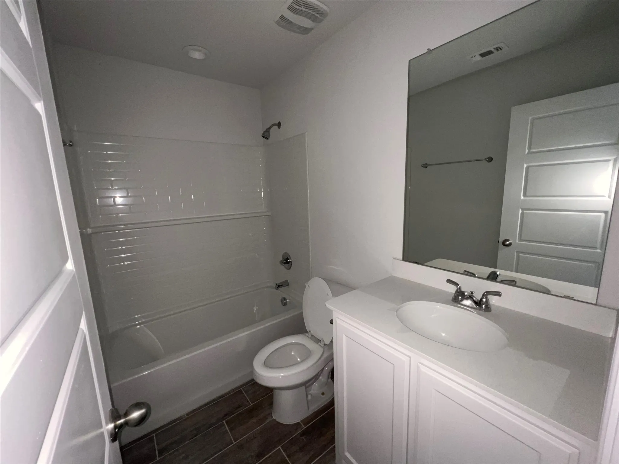 Seondary bathroom, with undermount sink and quartz counter.