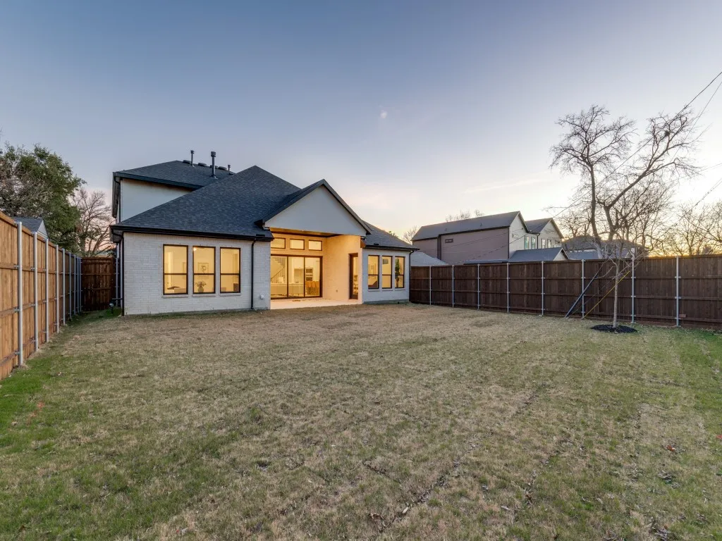 Back of house featuring a patio and a large, fenced backyard