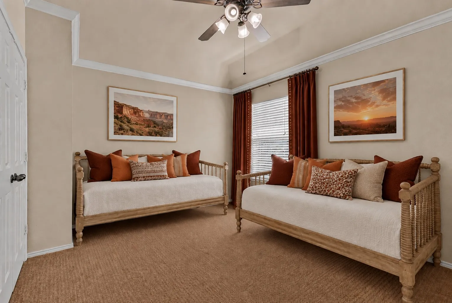 Vaulted ceiling with a ceiling fan, crown molding, wall-to-wall carpeting, and window blinds