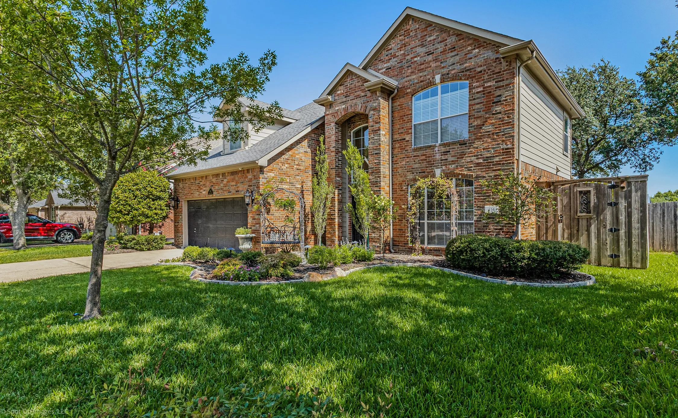 Brick exterior with gabled roofline and architectural windows
