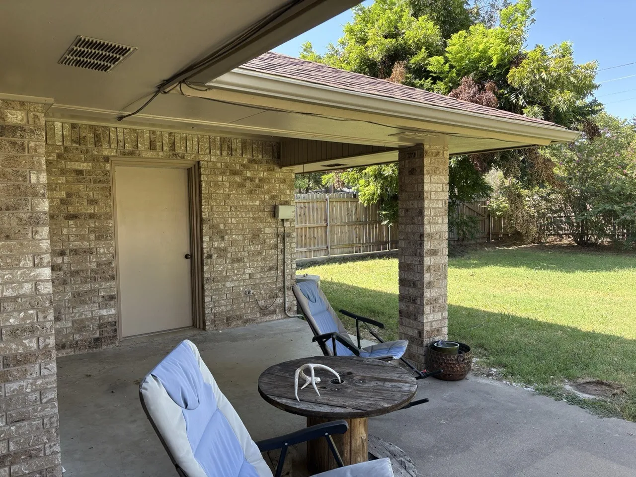 Patio showing entrance to bonus room/storage