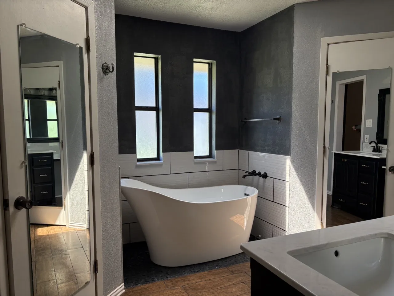 Master bathroom tub and closets