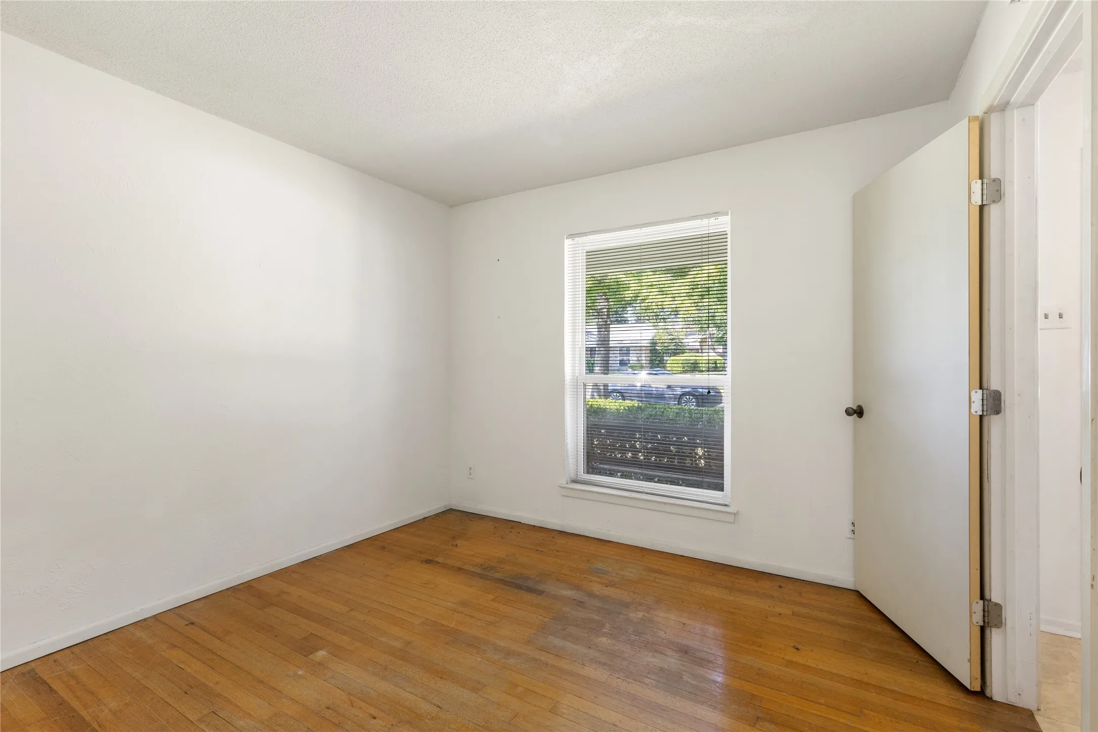 Hardwood flooring and a single-pane window