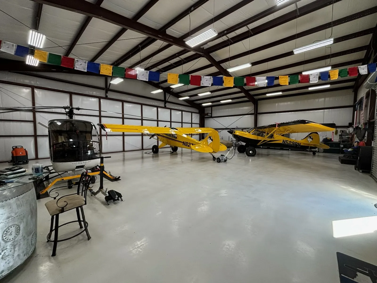 Spacious hangar with high ceilings and a polished concrete floor