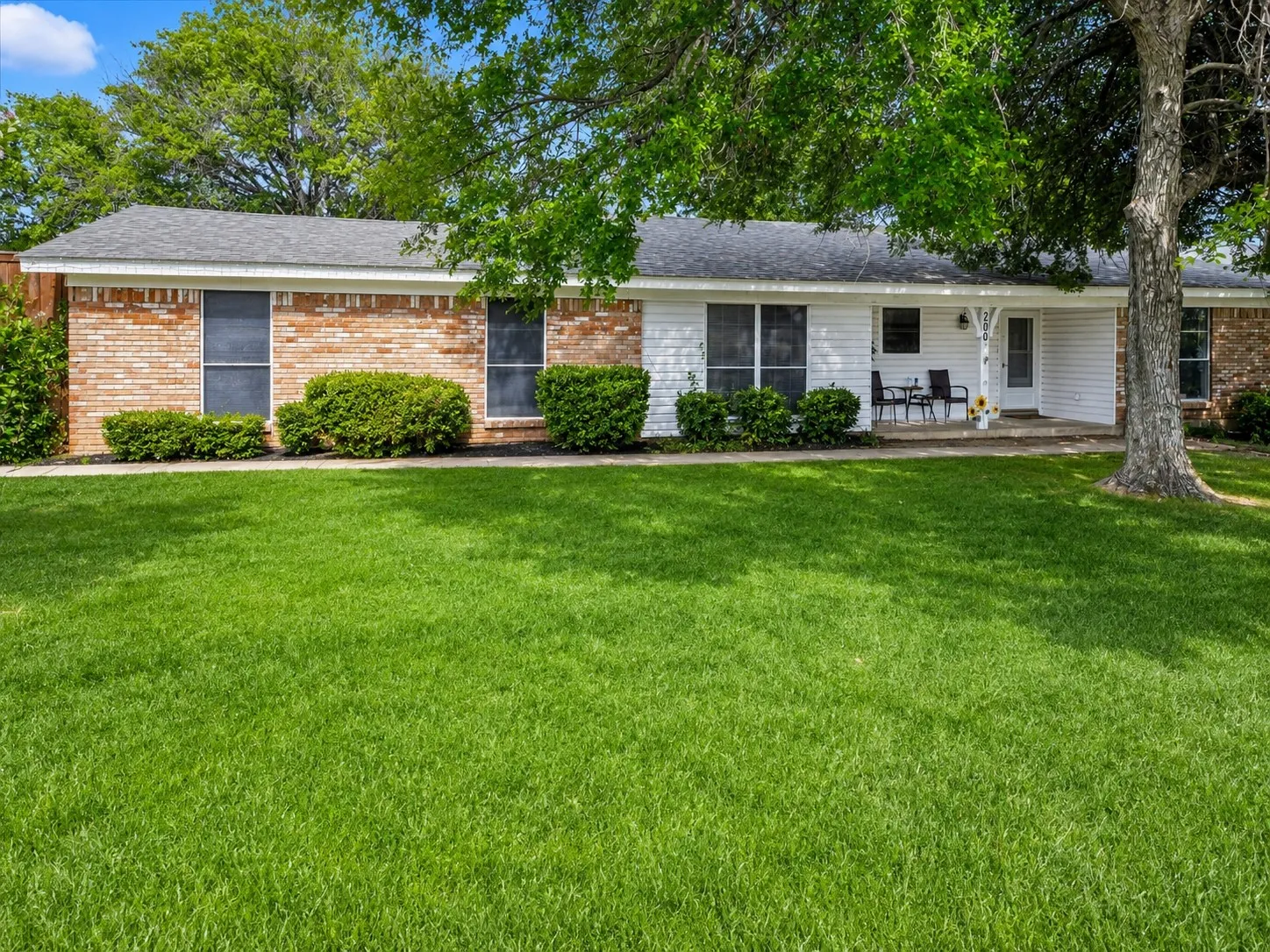 Brick and siding exterior with a covered front porch