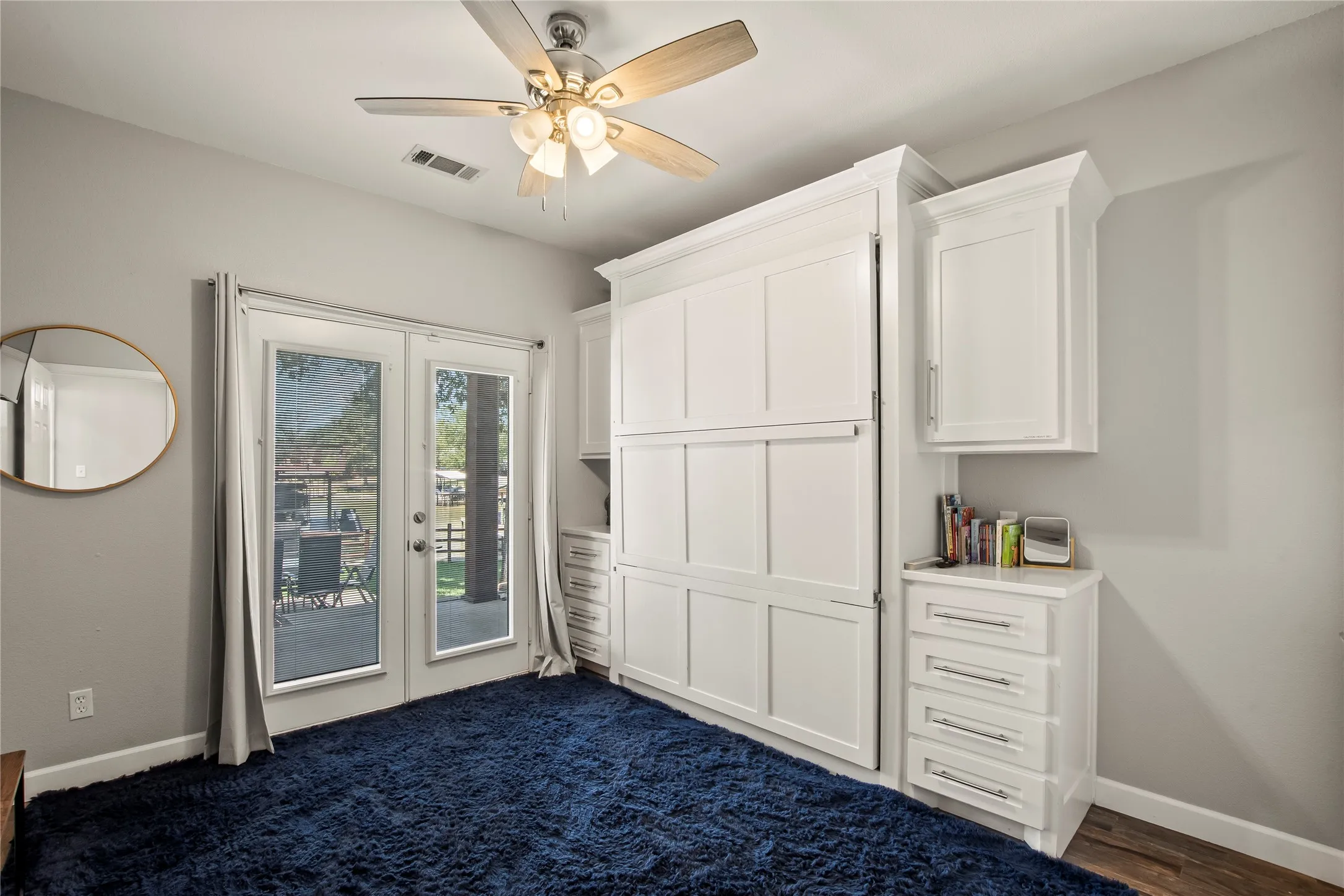 Main floor waterside bedroom 2 with Murphy bed.