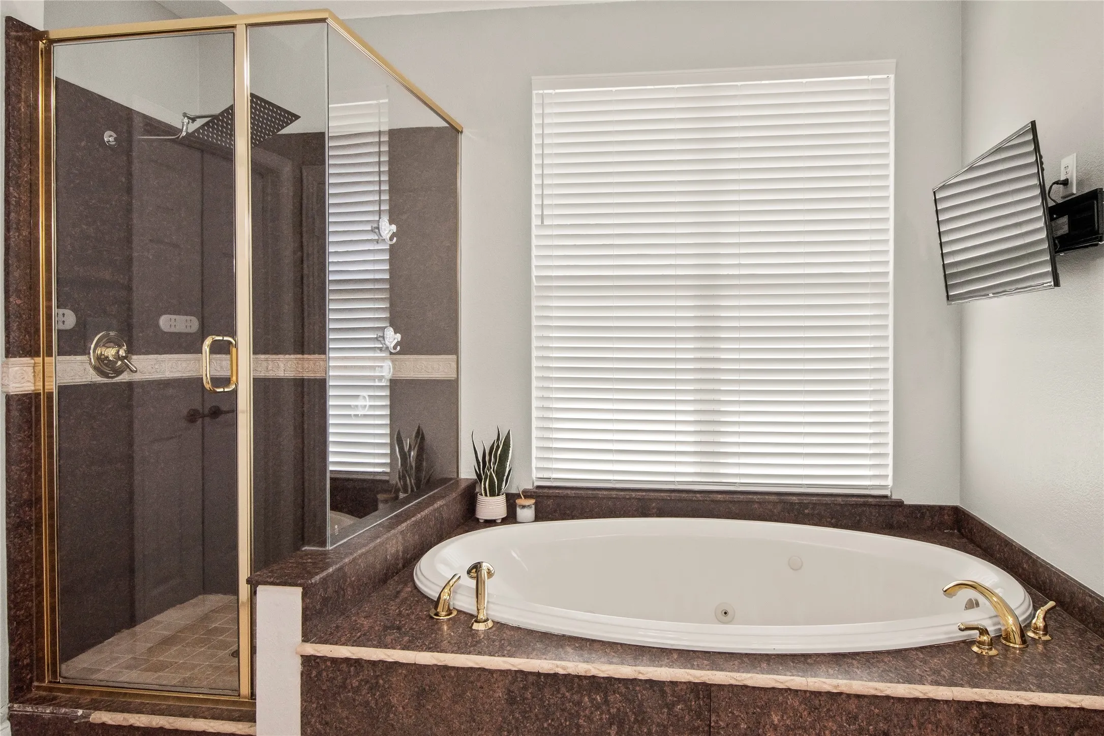 Primary bath with jet tub and separate walk in shower.