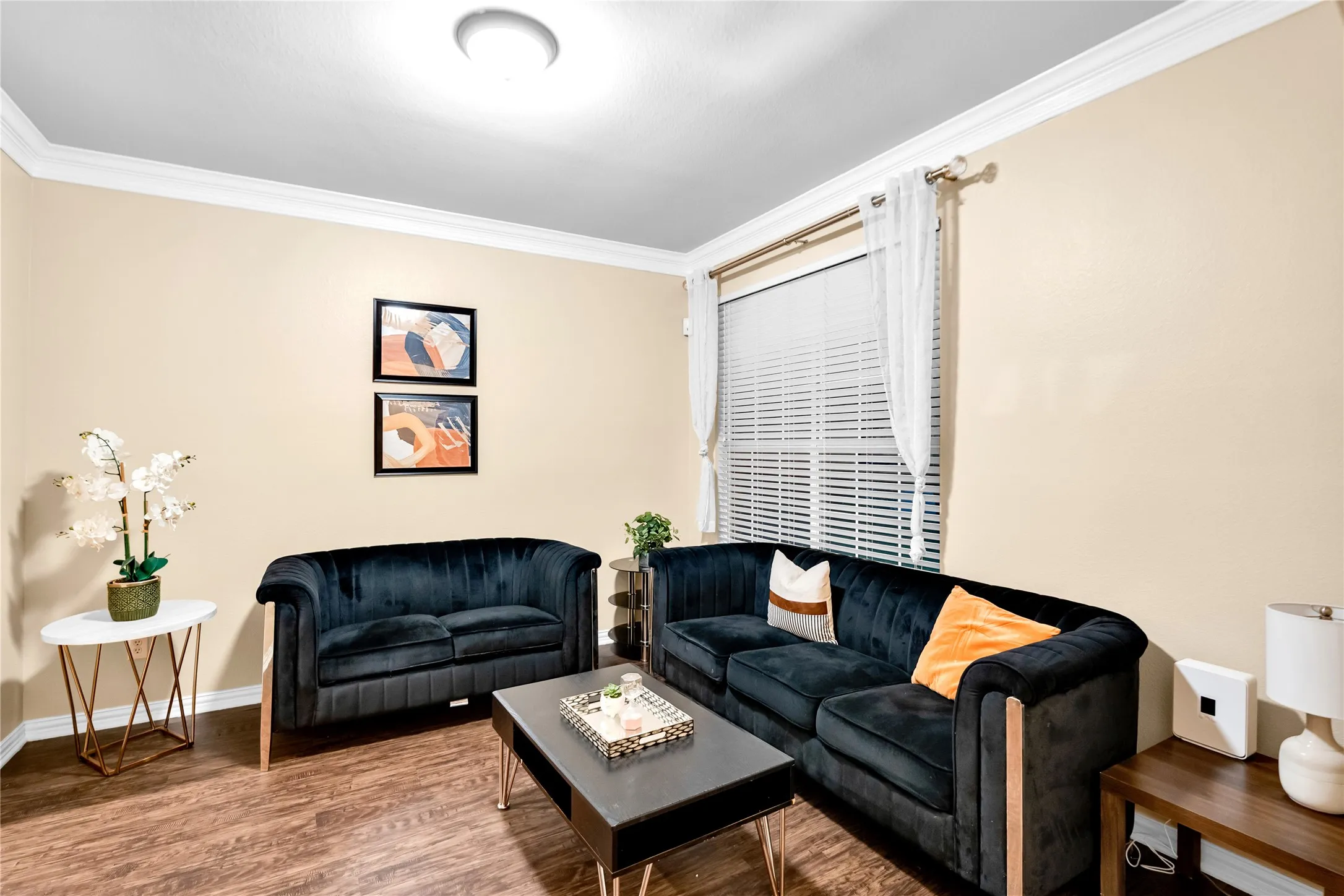 Crown molding, wood-finish flooring, and recessed ceiling lighting