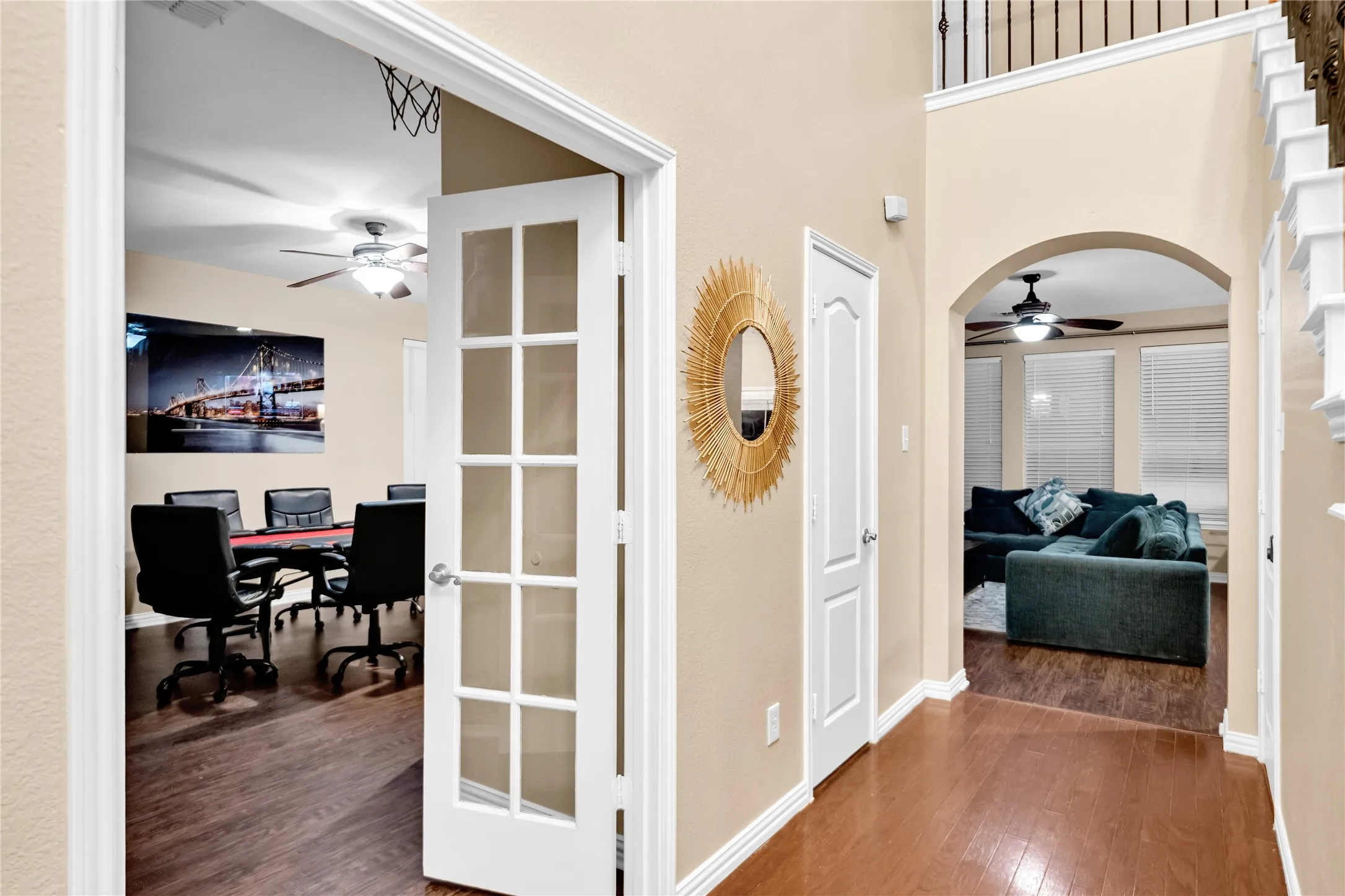 Wood-finish flooring, white trim, and neutral wall paint