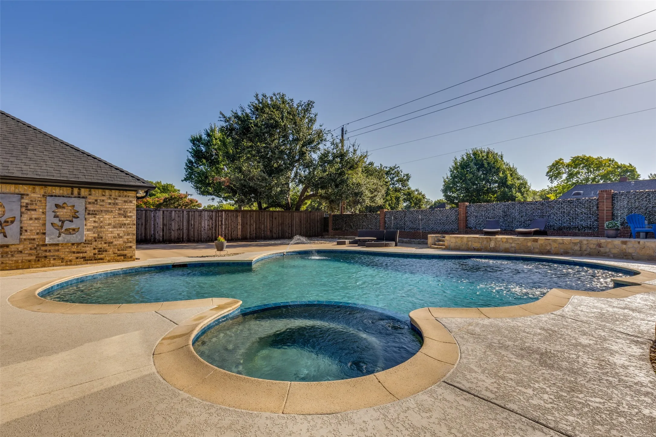 Beautifully shaped Pool and Cool Crete Decking just installed around the Pool