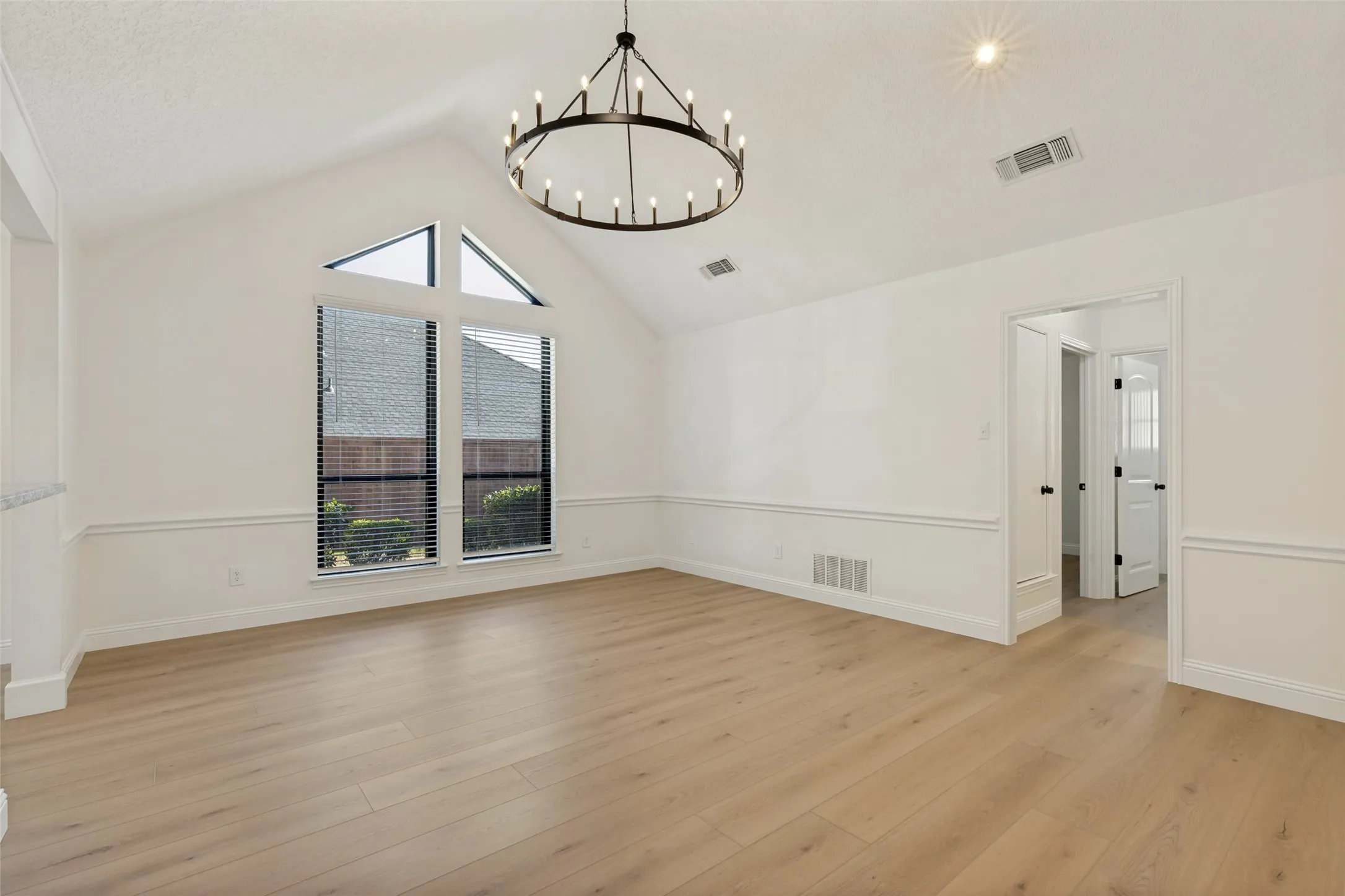 Second Living Room with Stunningly Beautiful Windows and Chandelier and Luxury Vinyl Plank Flooring