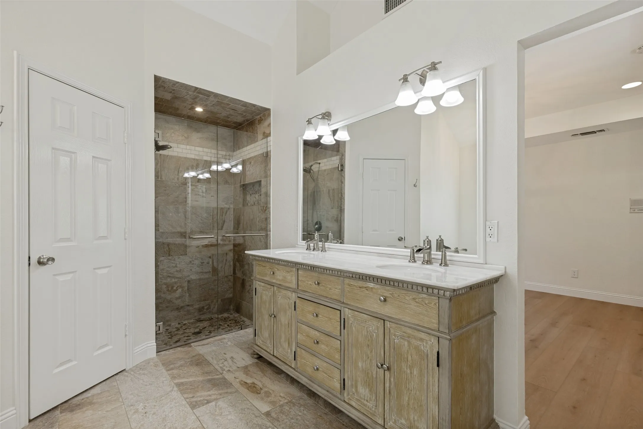 Primary Bathroom with Dual Sinks and Separate Shower