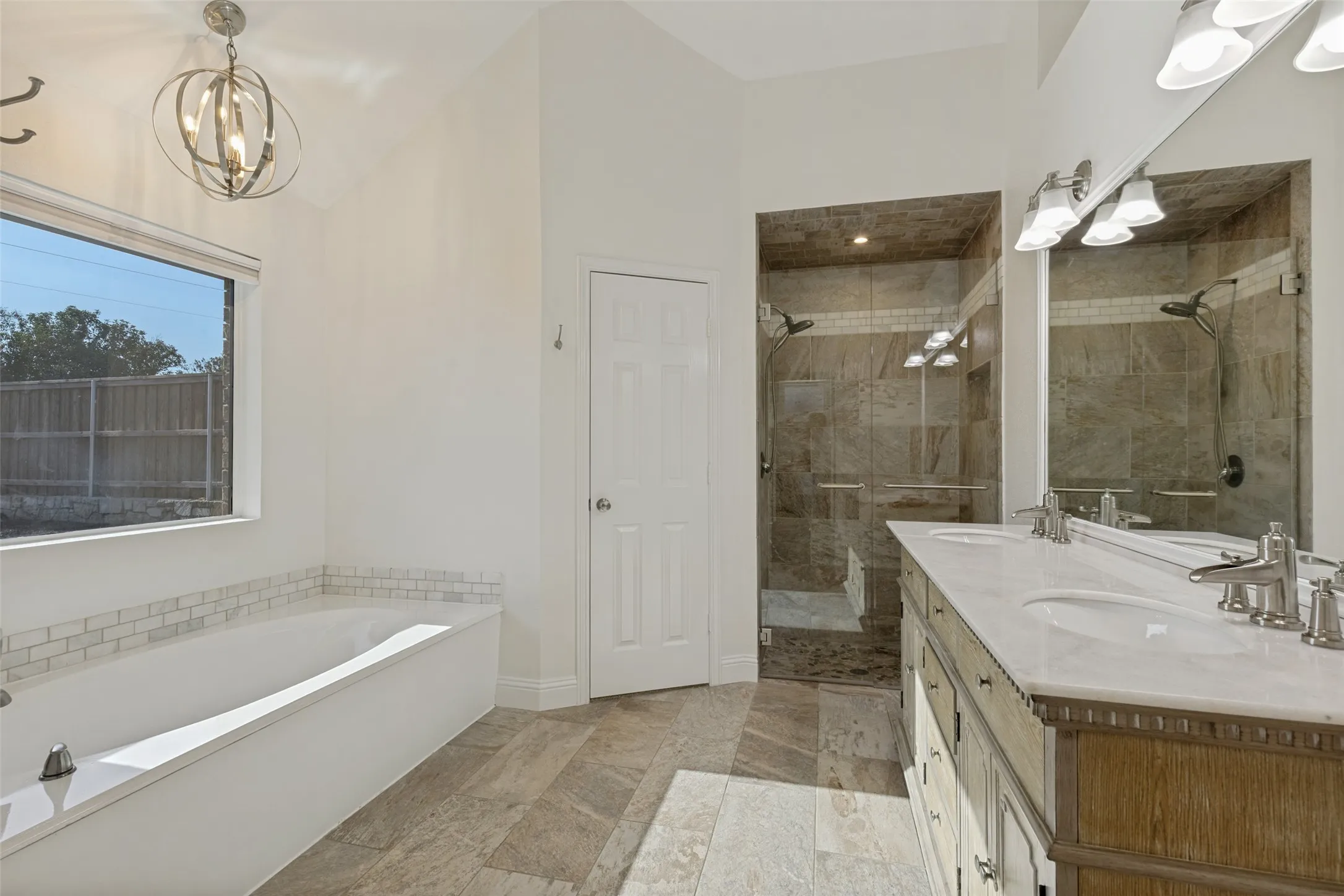 Primary Bathroom with Garden Tub, Separate Shower, Walk-in Closets and Great Looking Vanity with Marble Top