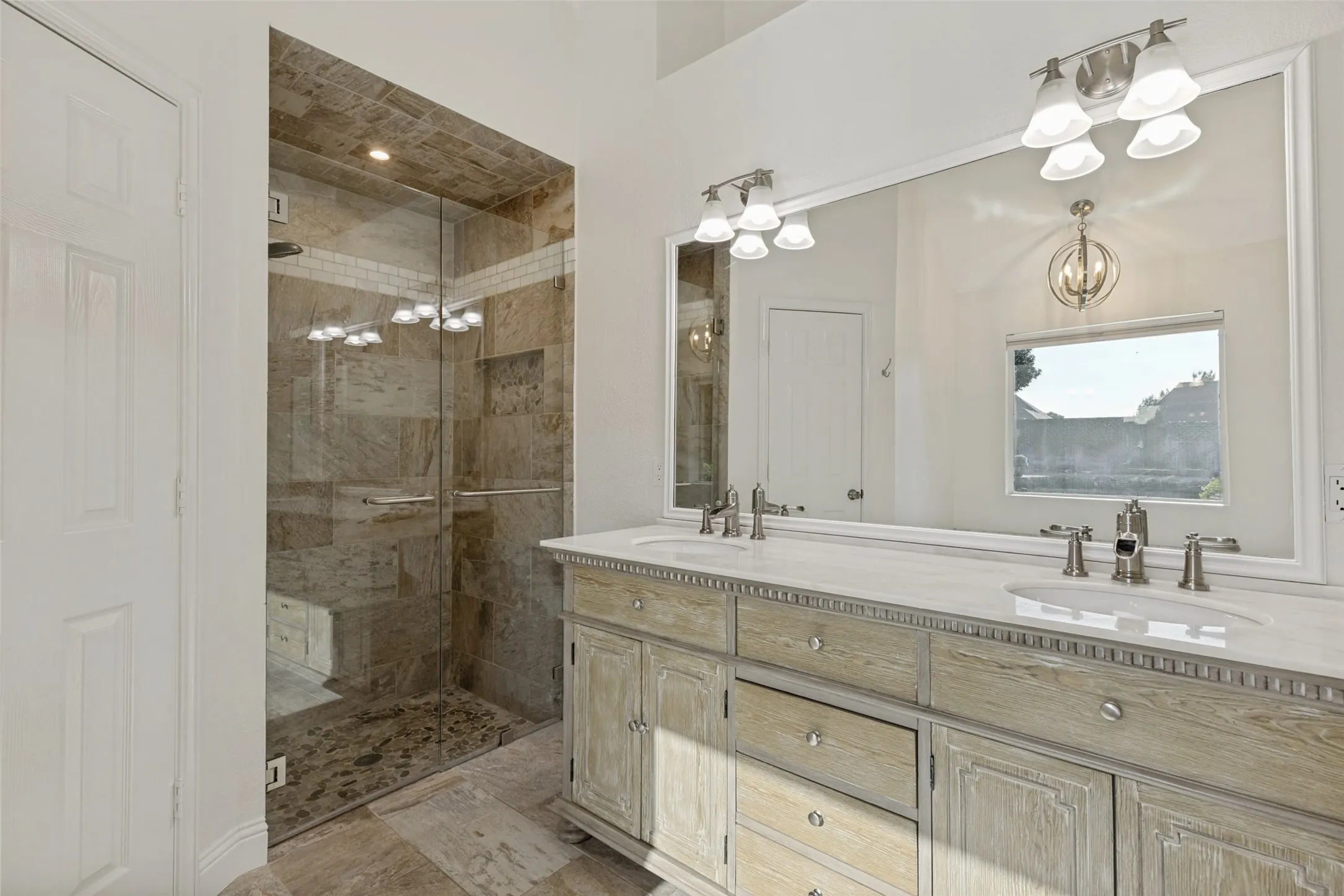 Primary Bathroom with Great Looking Vanity with Double Sinks and Marble Top
