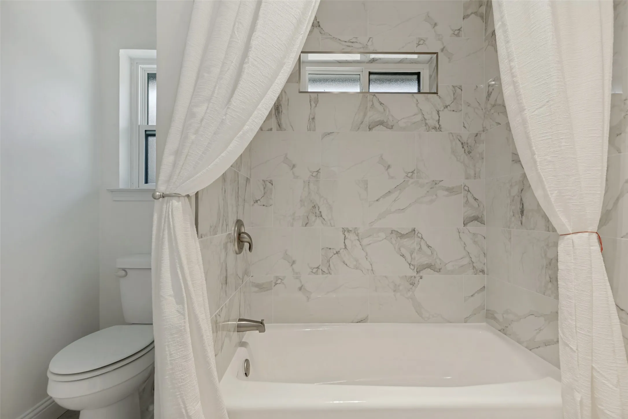 New Tile around the Tub/Shower Combination