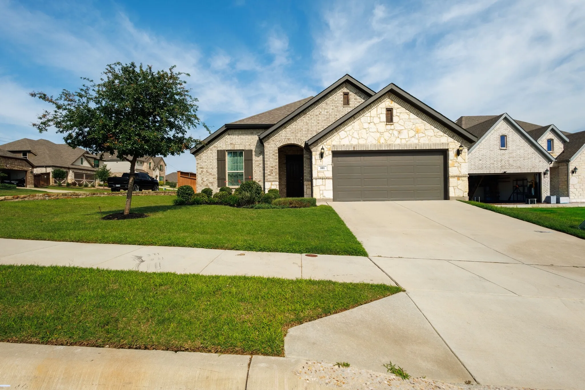 Stone and brick facade with gabled roof lines