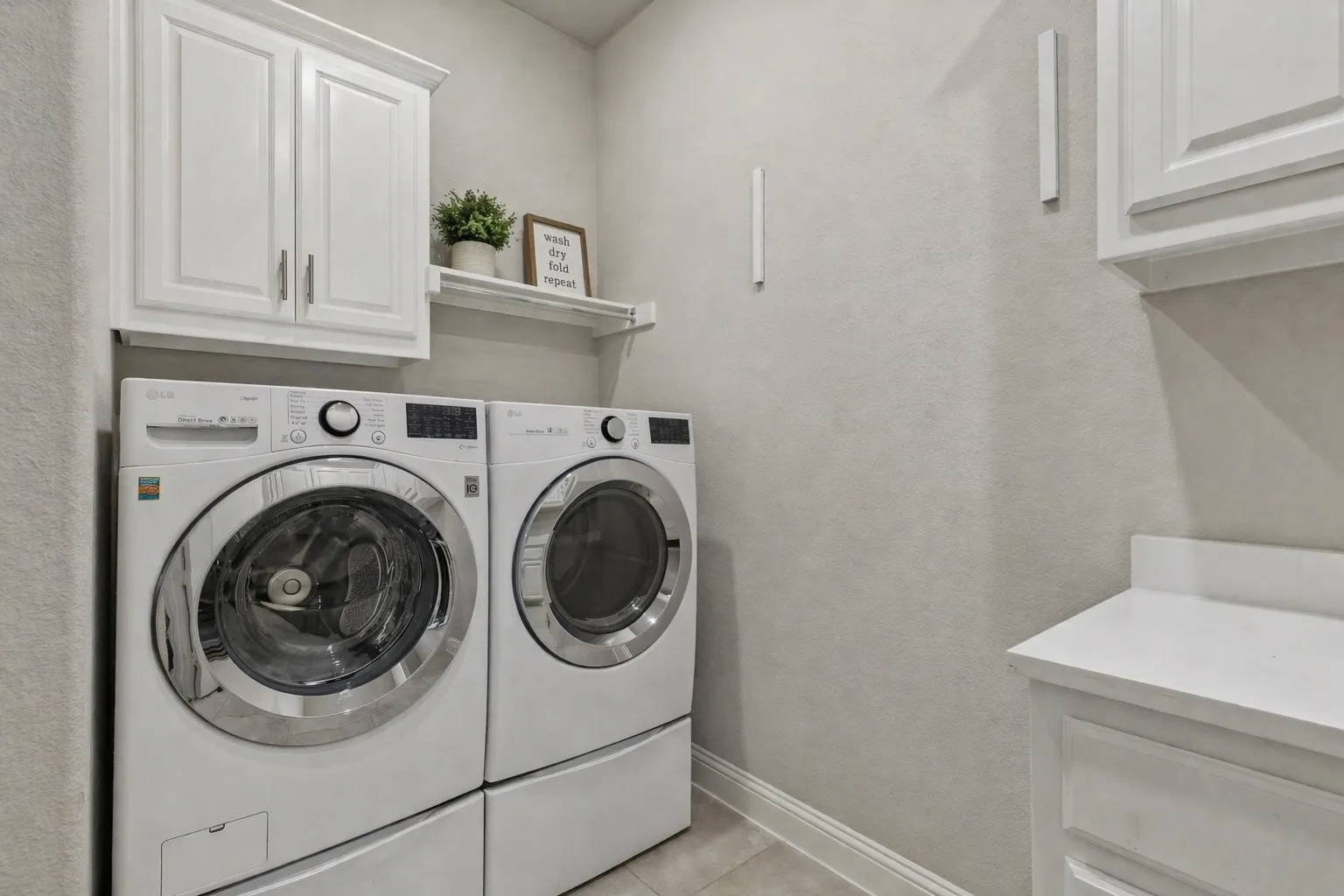 Laundry Room Featuring Ample Extra Cabinet Storage