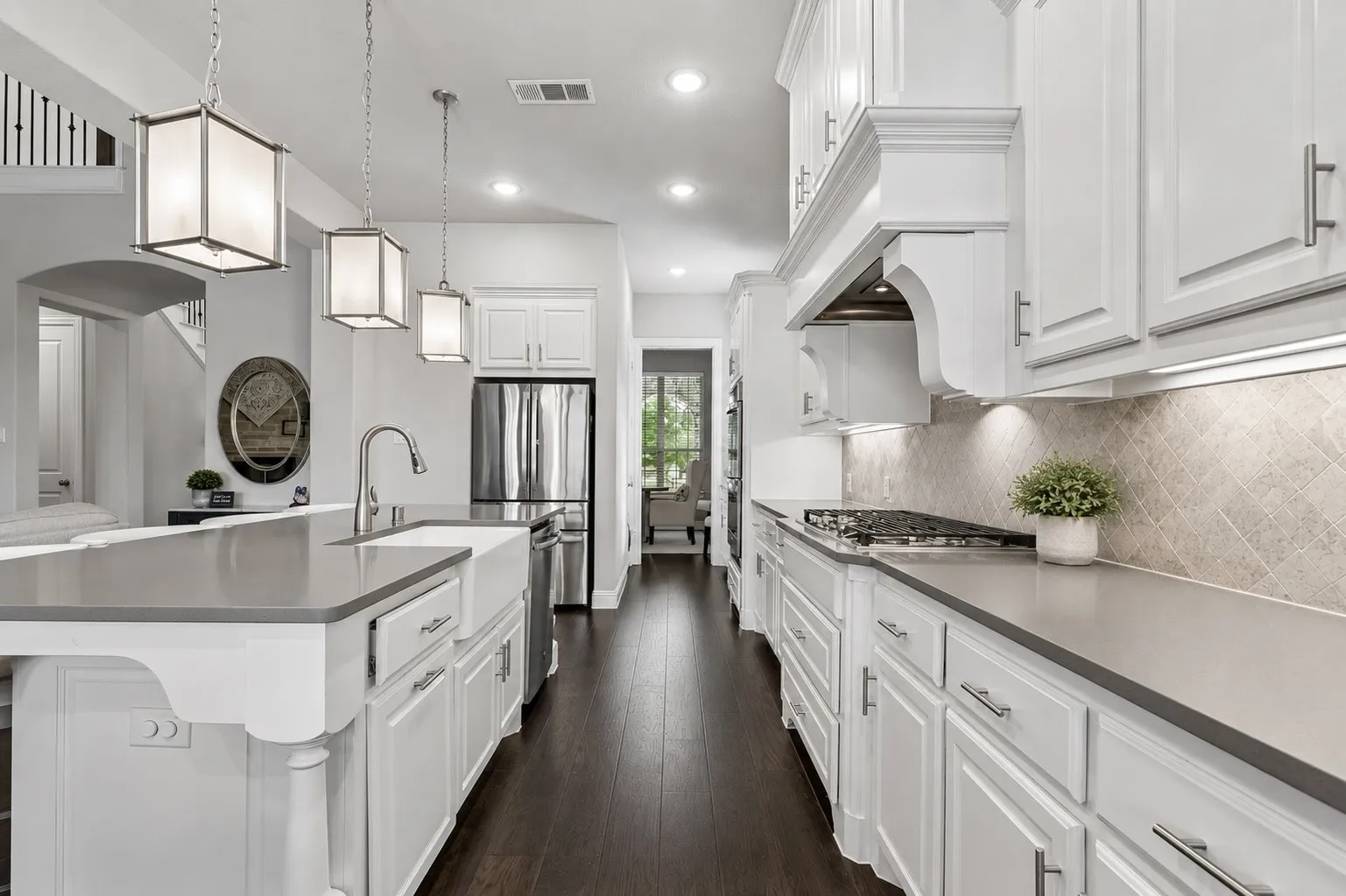Designer Kitchen With Gas Cooktop, Apron Sink, And Statement Island