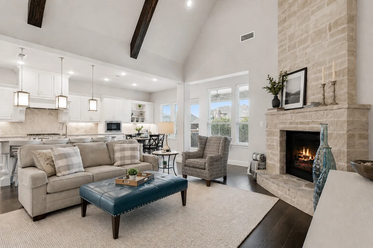 Stone Fireplace And Beamed Vaulted Ceiling Define The Main Living Room