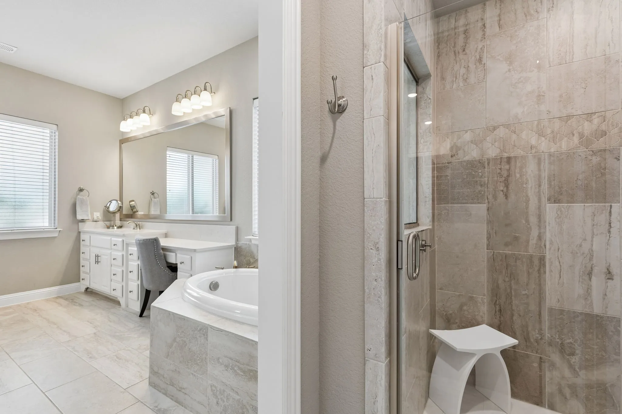Spa-Inspired Bath With Dual Vanities, Sit-Down Vanity, Soaking Tub, And Walk-In Shower