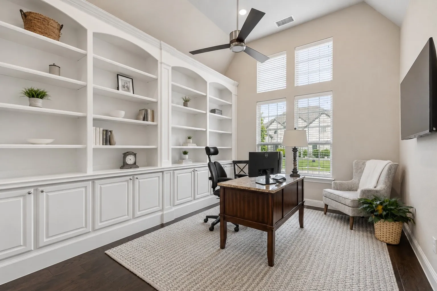 Dedicated Office Featuring French Doors, High Ceilings, And Wall Of Built-Ins