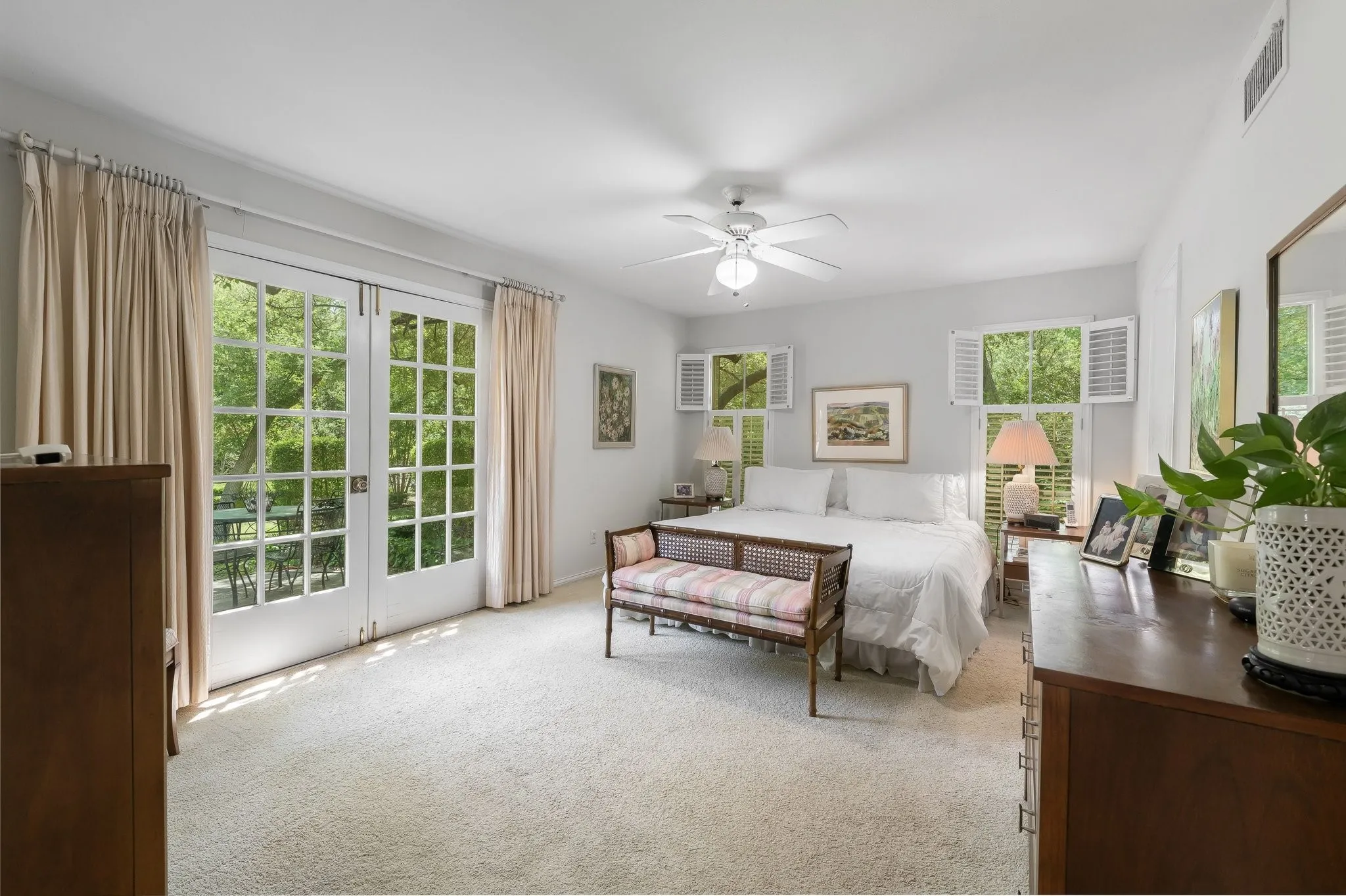 Primary Bedroom with French Doors for views of private back yard.