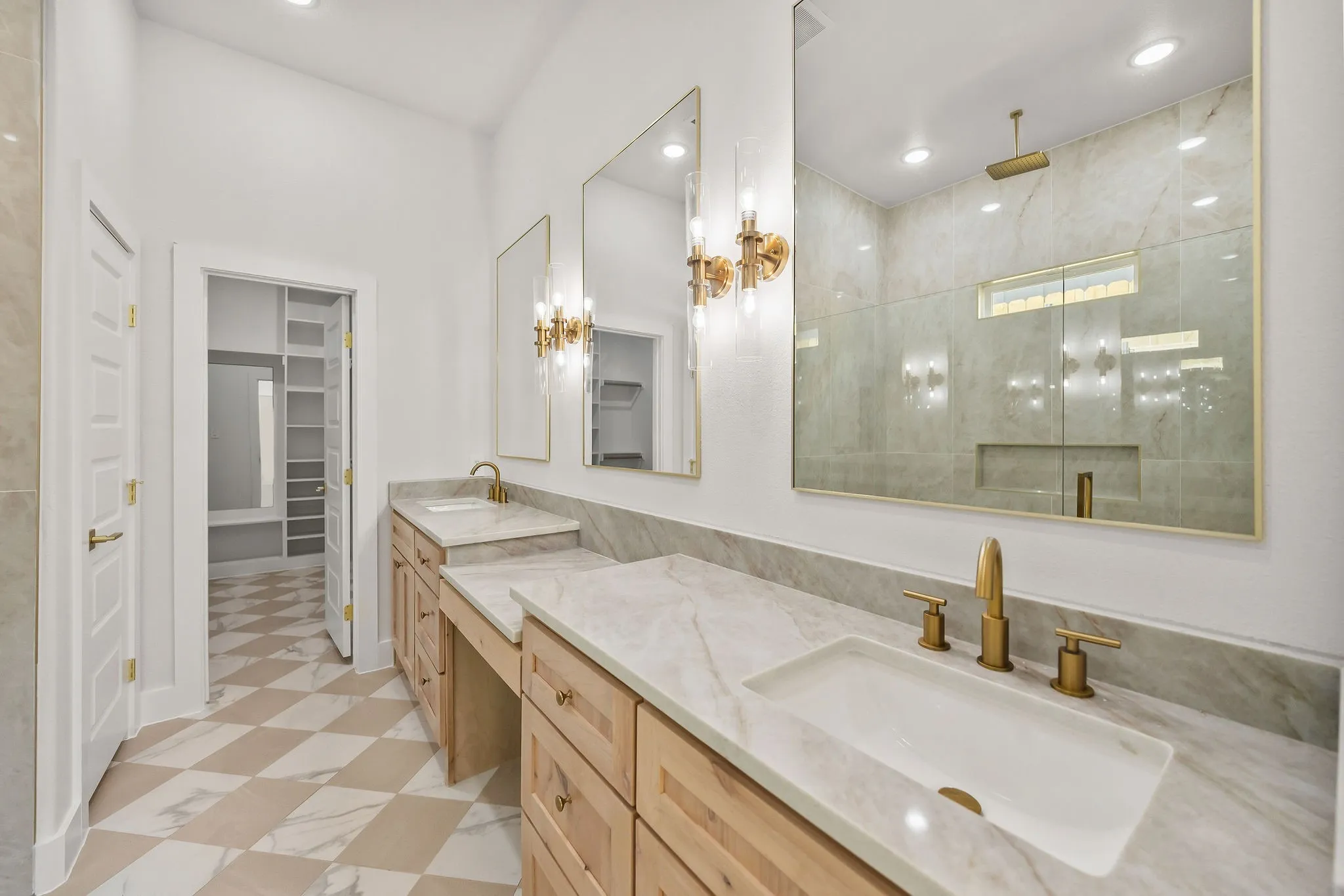Dual vanity with light wood-finish cabinetry and light-toned countertops