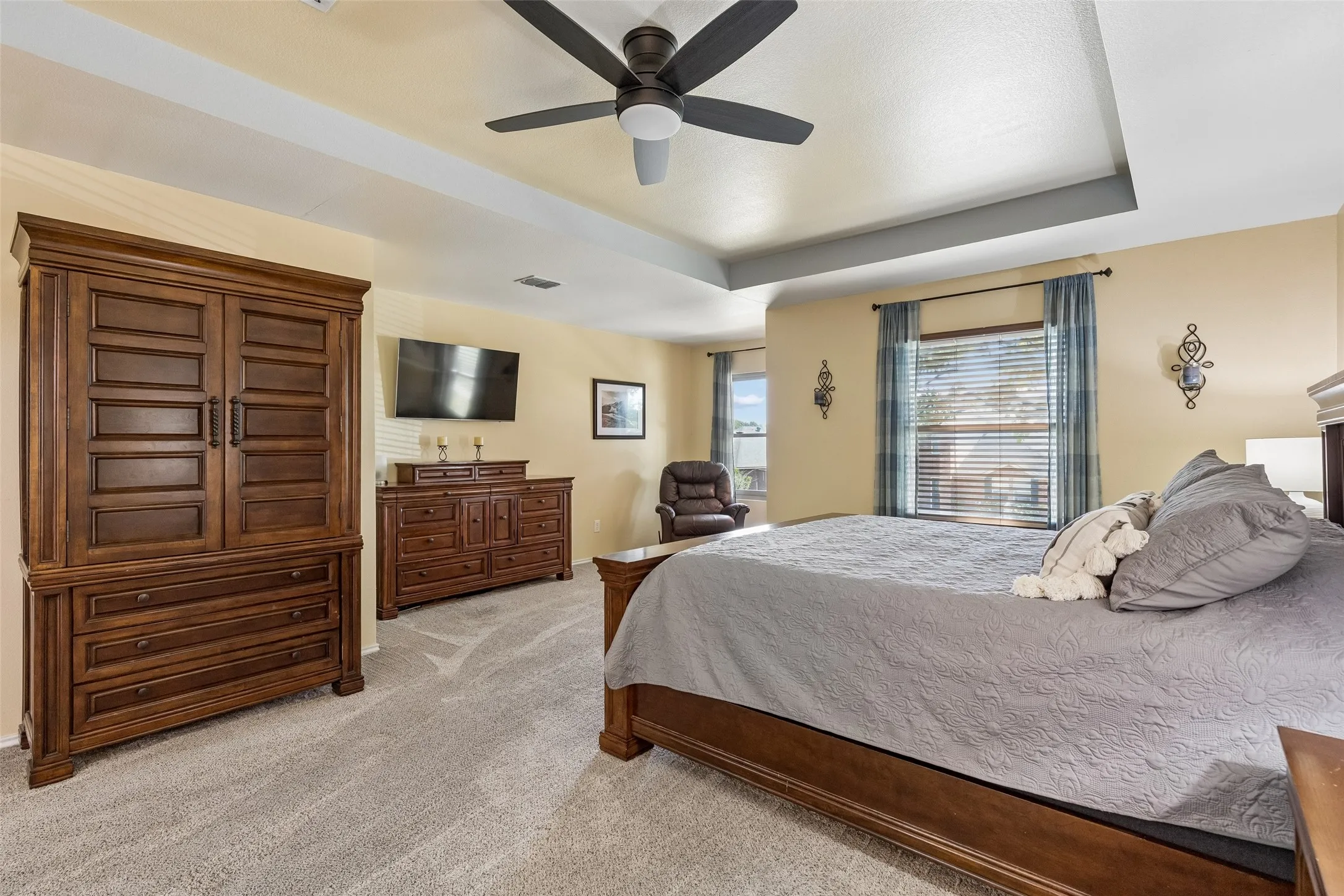 Space You Can Feel – A tray ceiling adds architectural dimension to the oversized primary bedroom, while multiple windows and generous wall space reinforce just how substantial this private retreat really is.