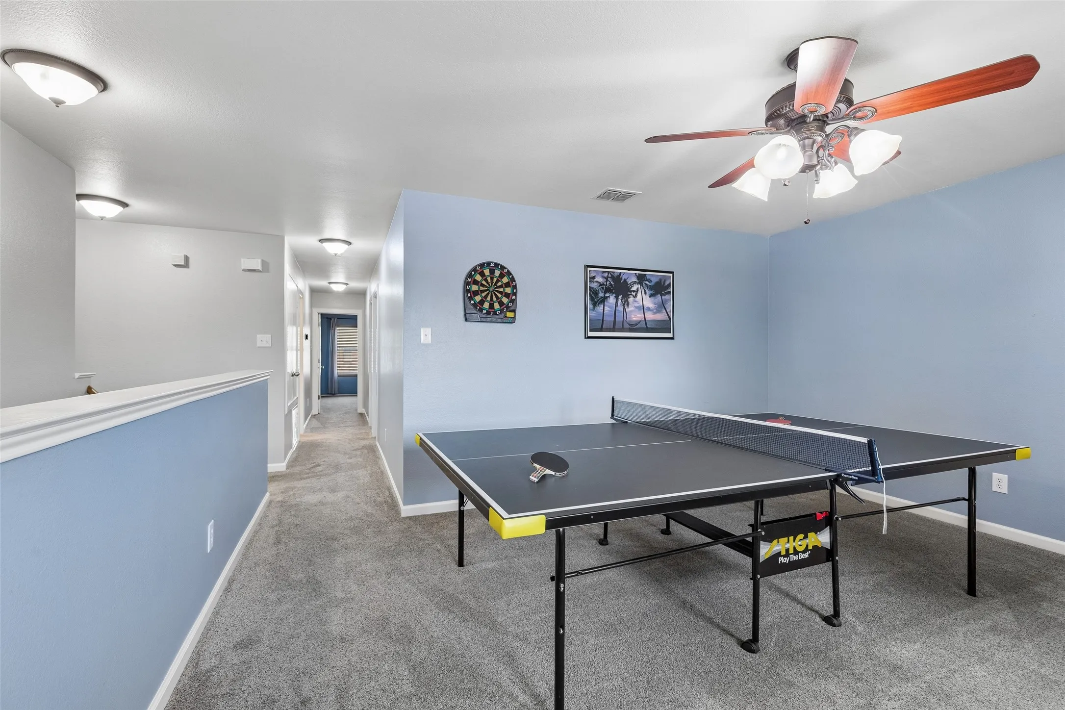 Flexible Upstairs Living Space – The game room sits conveniently near the secondary bedrooms and offers enough open floor space to adapt as needs change, with a ceiling fan and natural light adding everyday comfort.