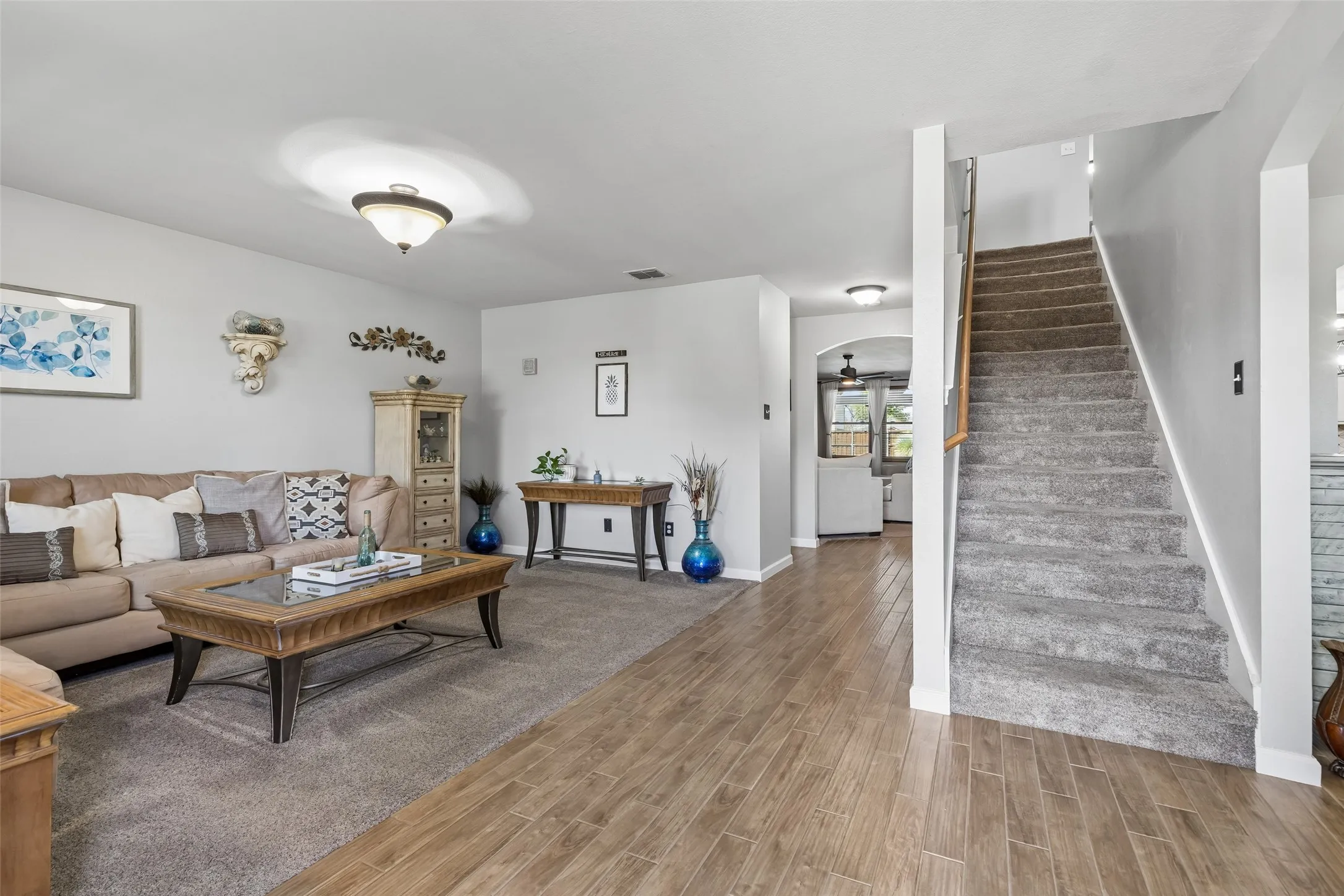 An Entry That Shows Off the Scale – Step inside and the home’s generous proportions are immediately apparent, with a spacious formal living area and a long sightline that carries through the main level toward the dining room, kitchen, and family room.