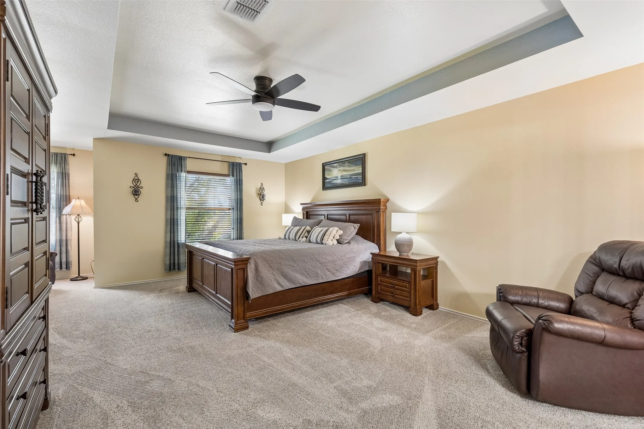 An Exceptionally Spacious Primary Retreat – At approximately 18 by 25 feet, the upstairs primary bedroom offers impressive proportions, abundant natural light, and plenty of space to create separate sleeping and sitting areas.