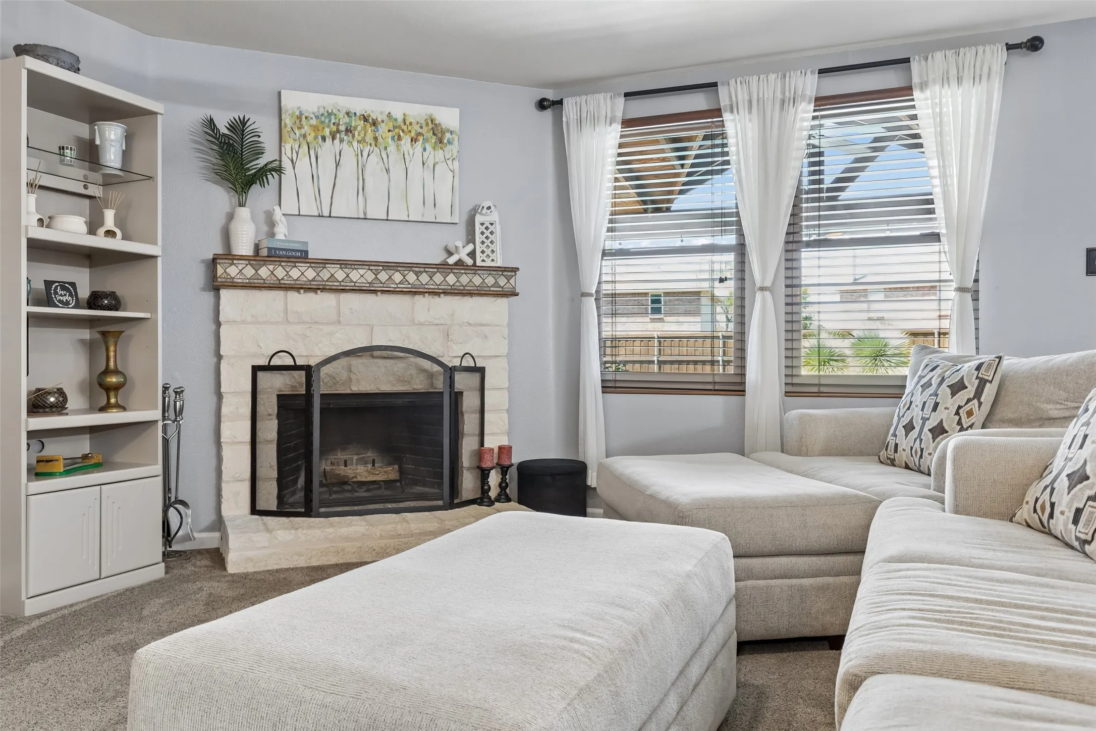 Austin Stone Fireplace Focal Point – The stone-surround fireplace gives the family room a strong architectural centerpiece, creating a comfortable gathering space with plenty of room to spread out.