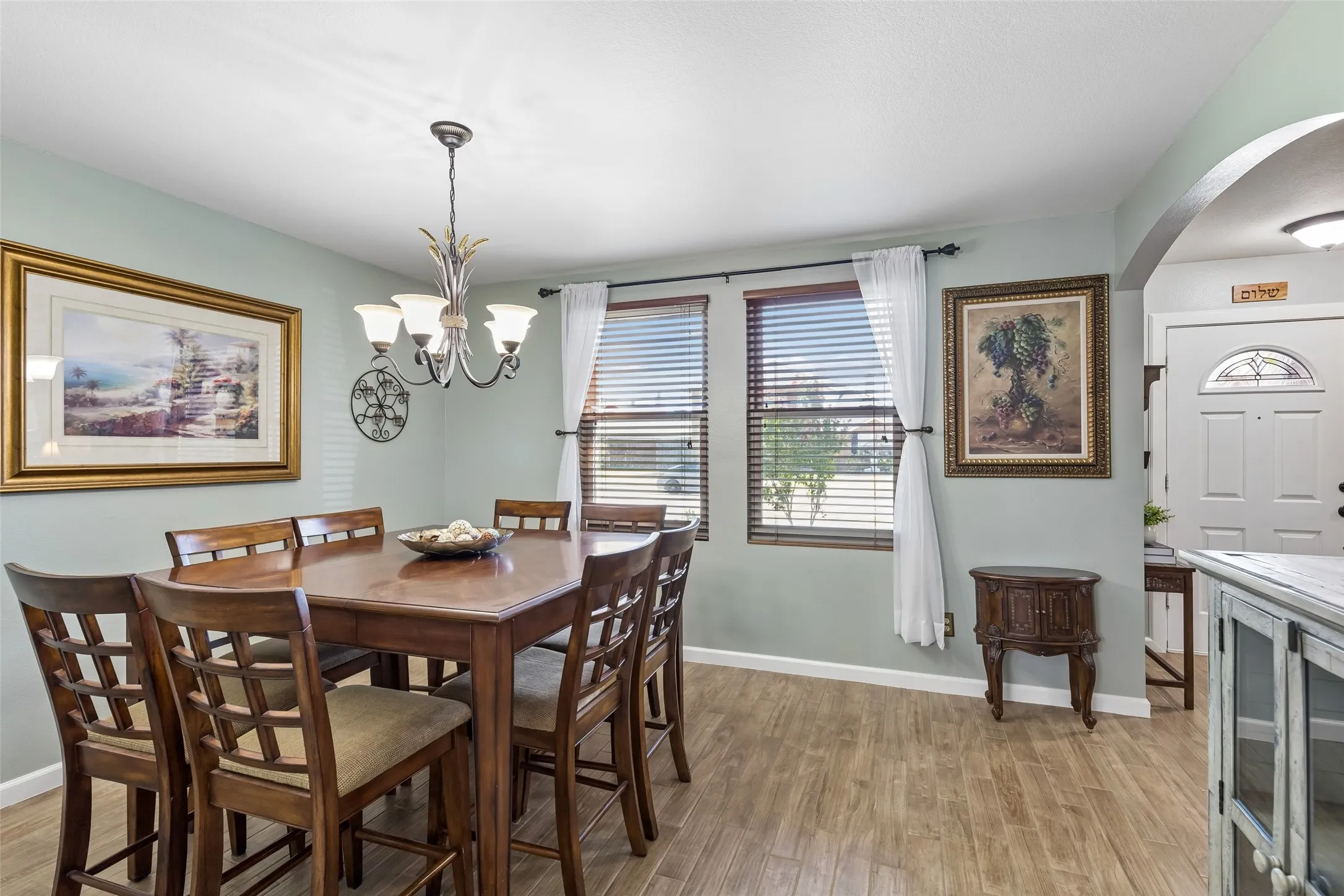 Natural Light for the Dining Room – Two front-facing windows brighten this generously sized dining space, while the arched opening creates a graceful transition to the adjacent living areas.