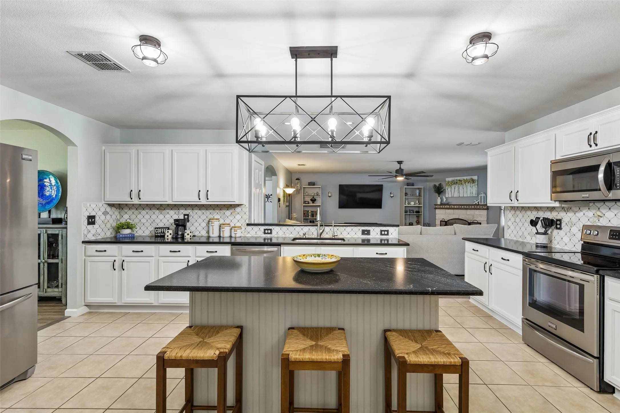 Designed for Cooking and Connection – Counter-height island seating, extensive prep space, and an open view into the family room make it easy to cook, serve, and stay connected to the activity beyond.