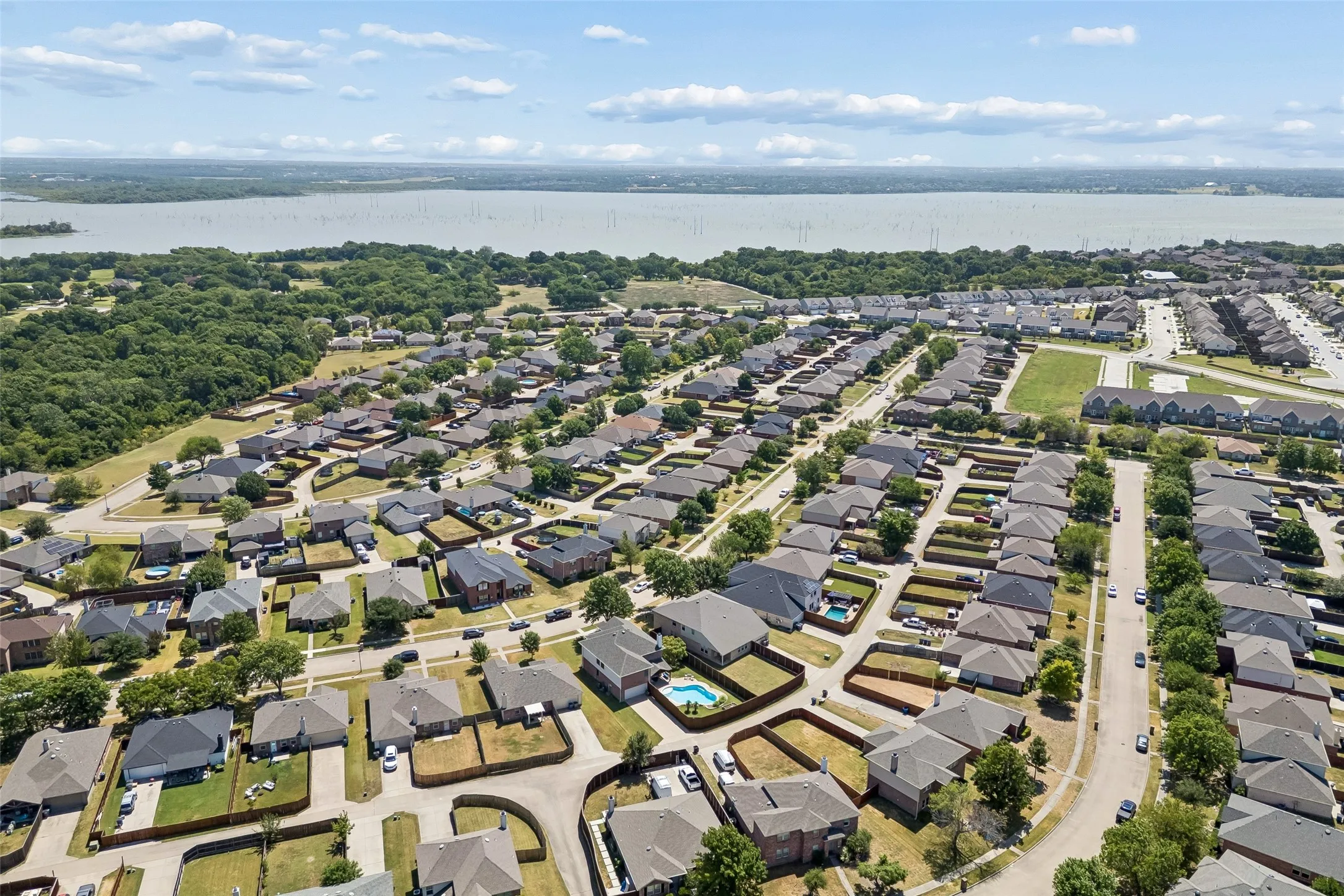 Wylie Location with Rockwall ISD – An elevated neighborhood view highlights the home’s setting in Wylie, offering the benefit of award-winning Rockwall ISD schools without crossing the bridge.
