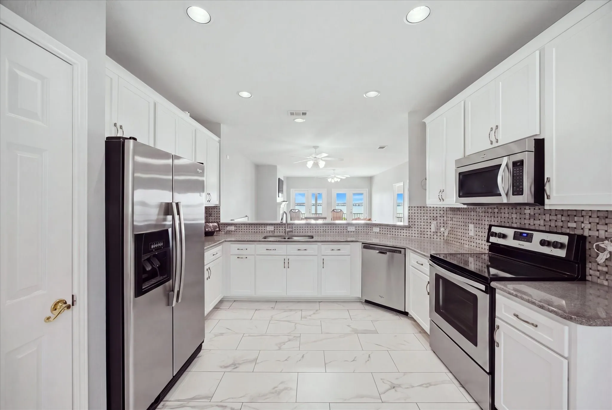 Updated kitchen includes an abundance of cabinetry and counter top space