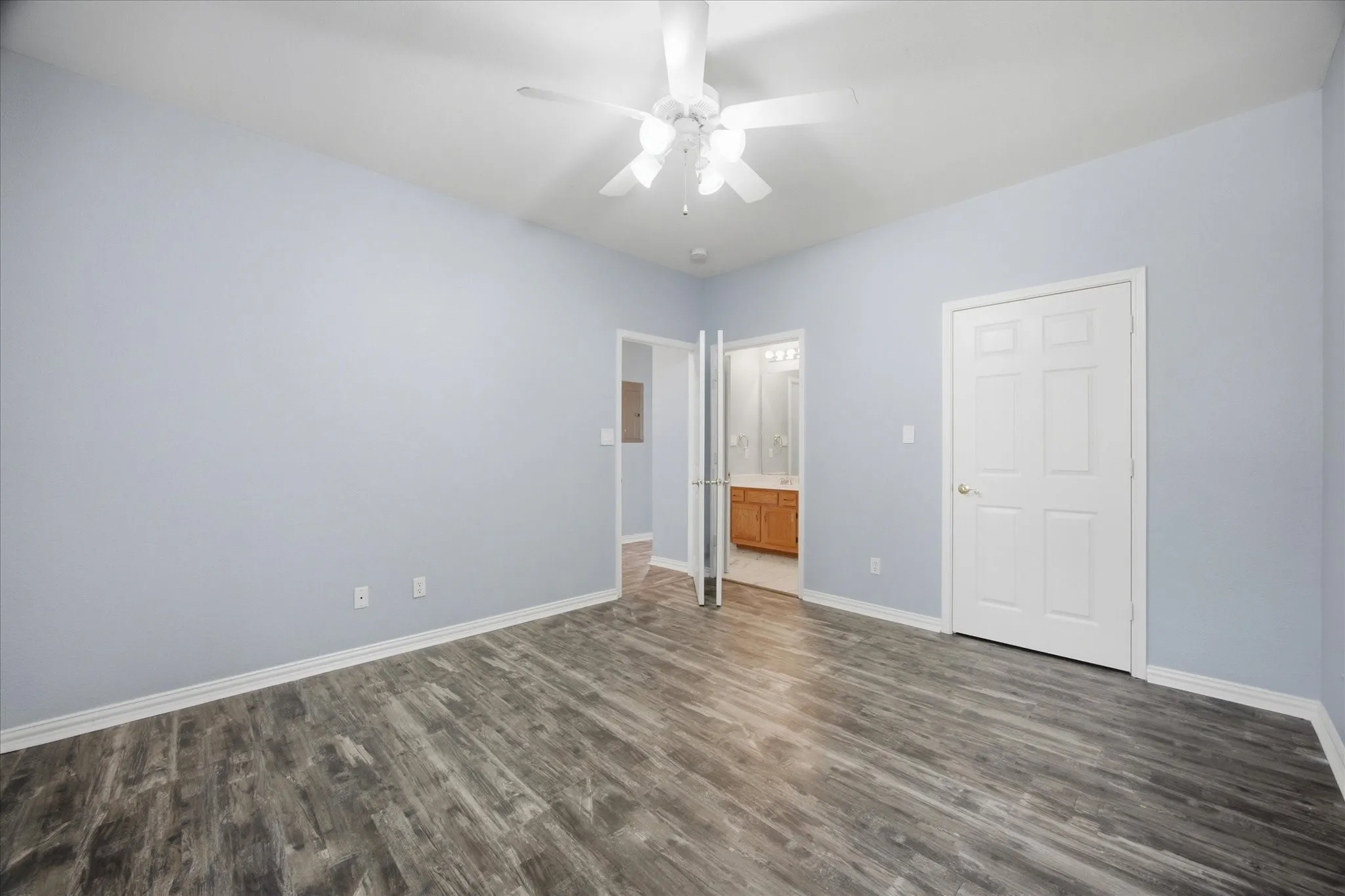 Spacious bedroom opens onto full bath