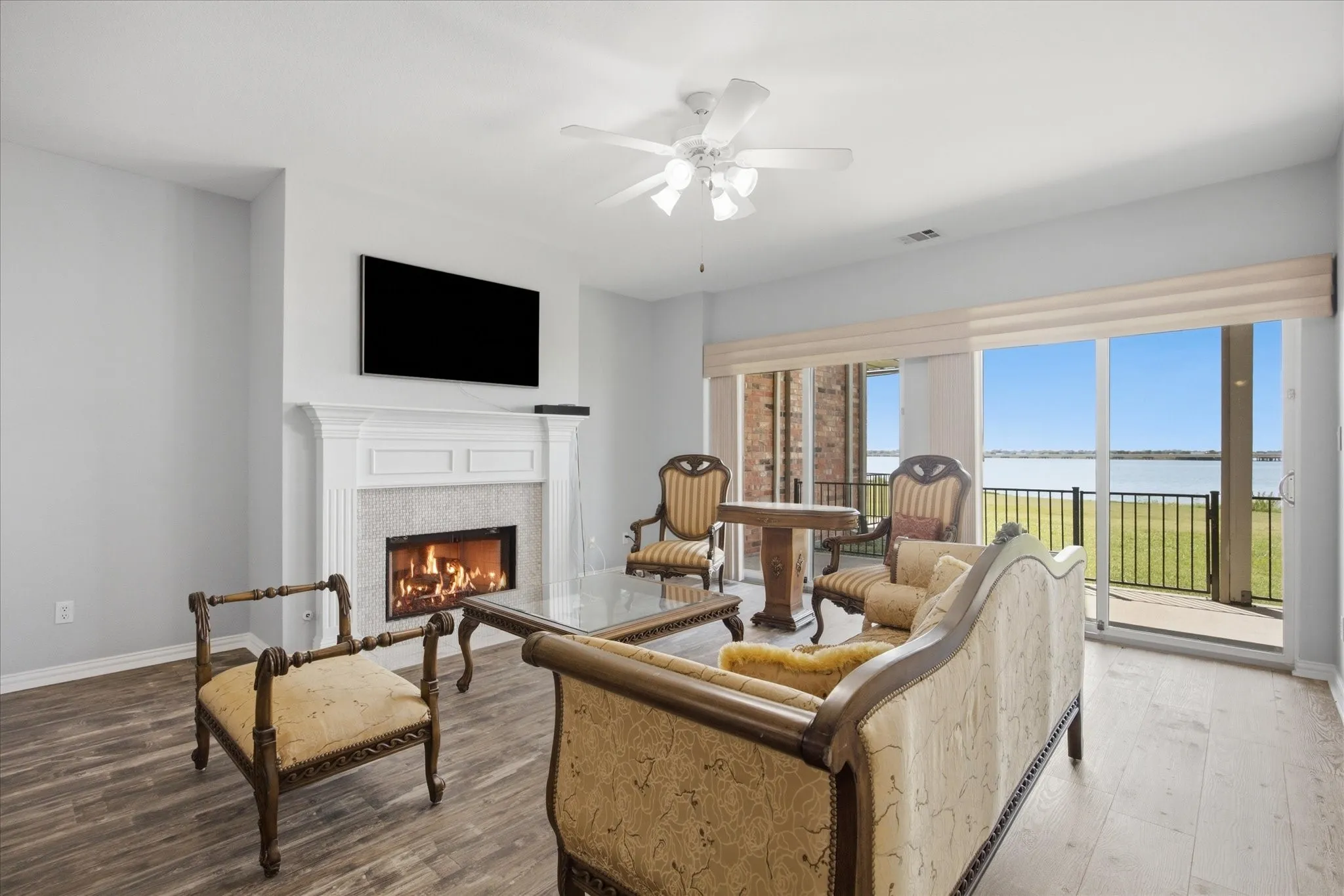 Family room includes spectacular lake view and beautiful fireplace