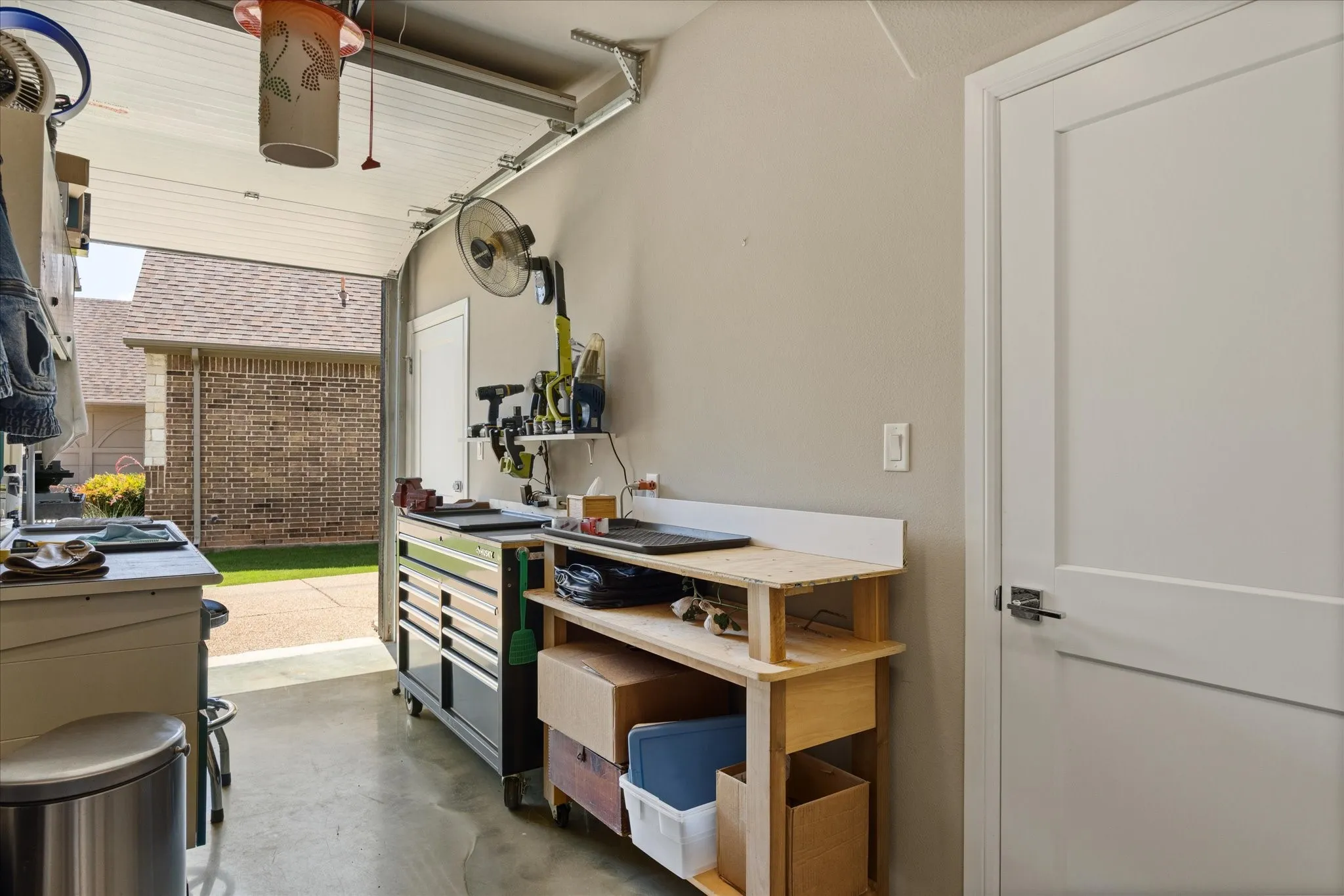 Golf cart garage / workshop / storage with remote controlled roll up door.