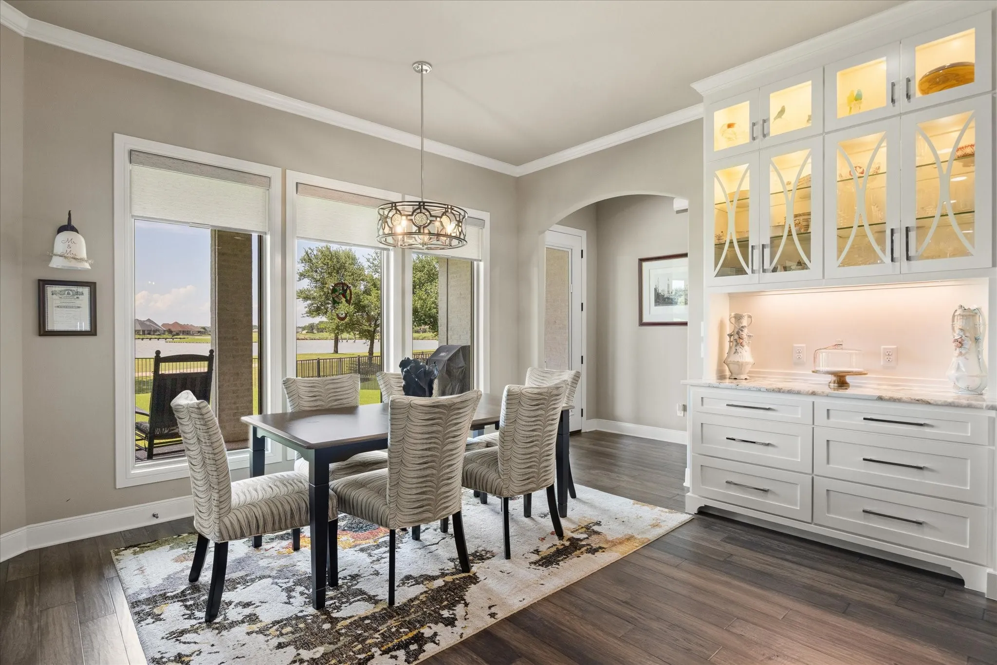 Spacious dining area flows seamlessly into the chef-inspired kitchen, creating an inviting setting for both everyday living and effortless entertaining.