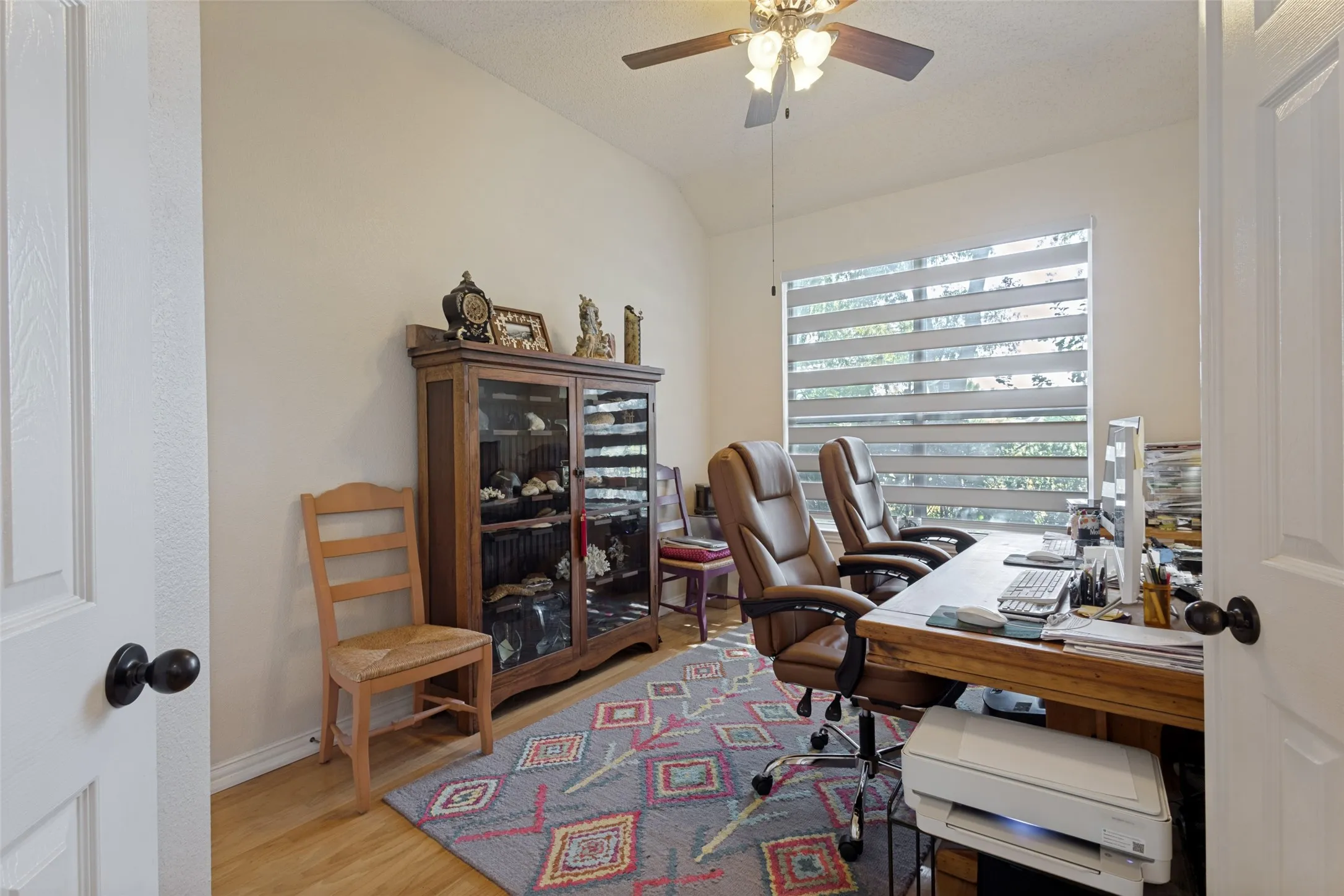Downstairs 2nd bedroom with hardwoods, full closet zebra blinds, presently used as a study.
